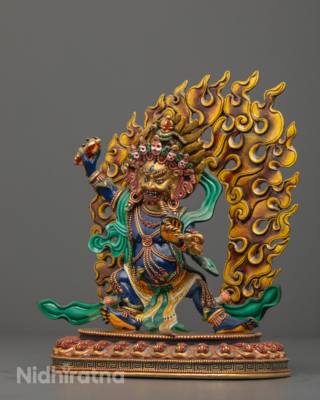 Vajrapani statue’s lotus throne, sun disc, and lower garment made of tiger skin, featuring precise traditional carvings and rich acrylic colors