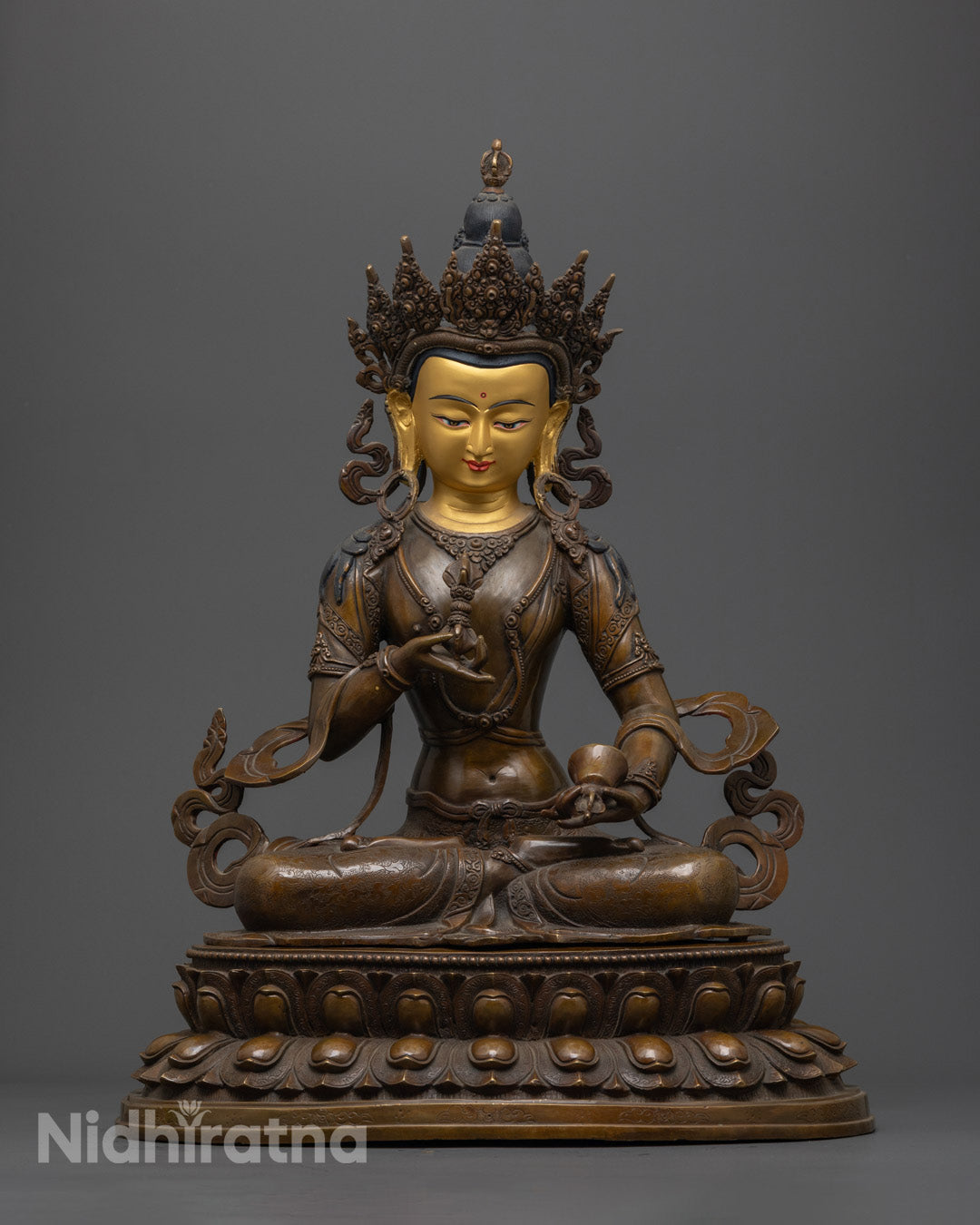 Vajrasattva Buddha statue in meditation posture with 24K gold face and oxidized copper body, holding vajra and bell on lotus throne