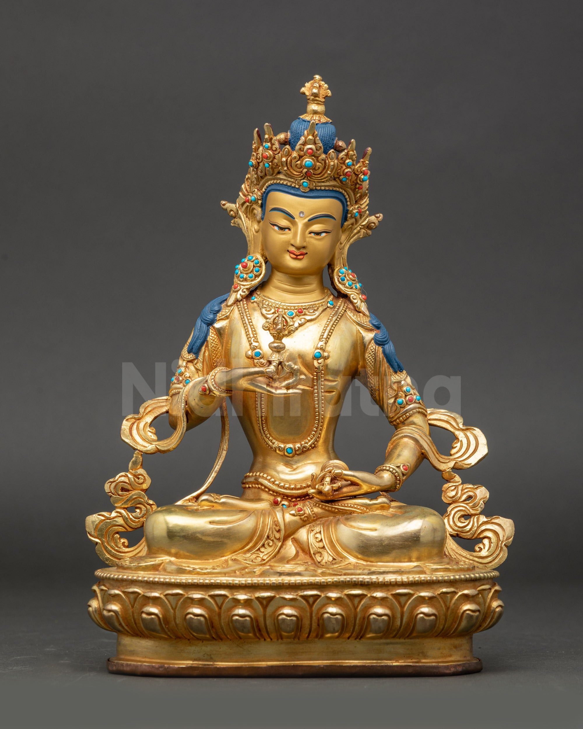 Vajrasattva Buddhist statue with gold-gilded face seated on lotus throne