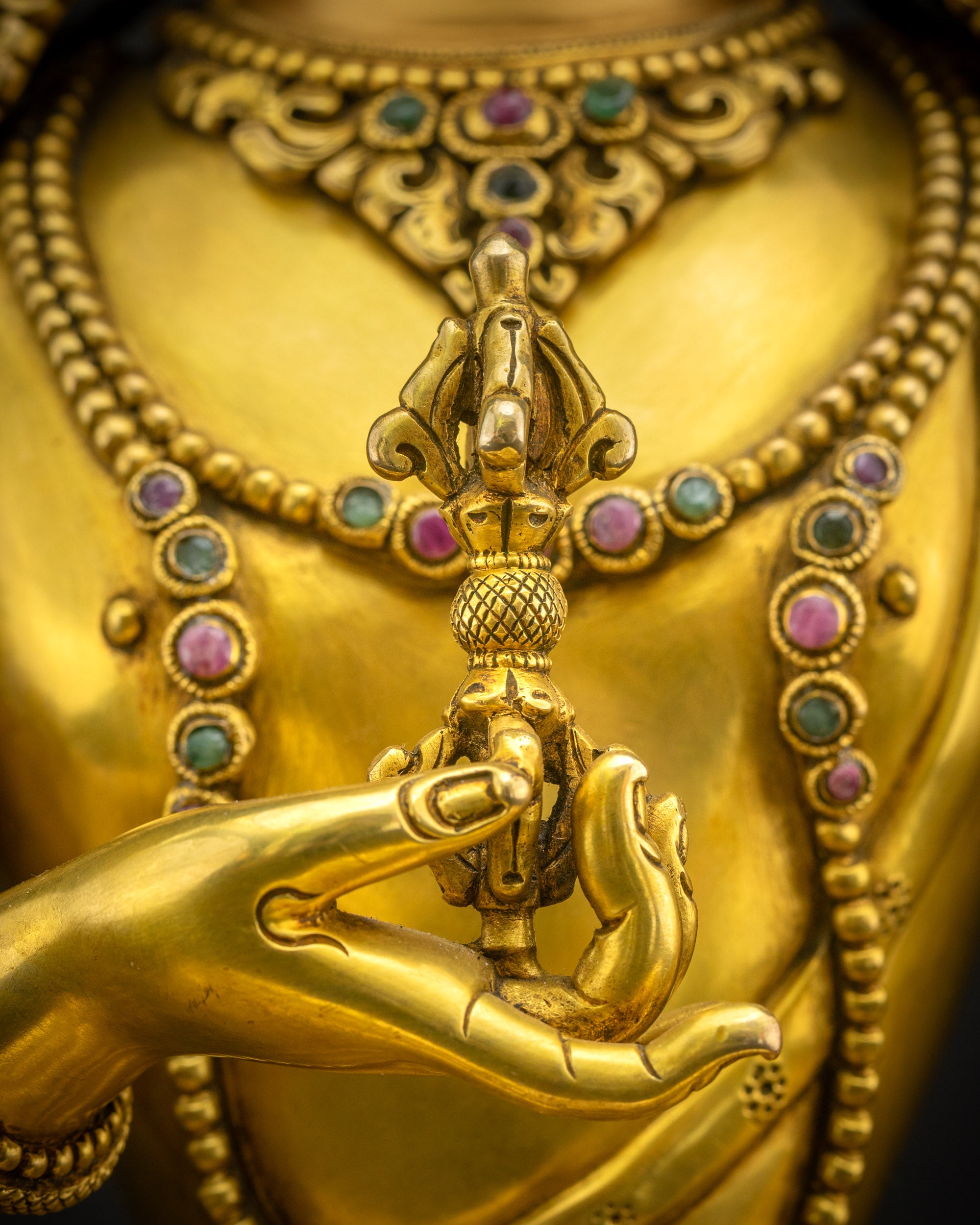 Close-up of Vajrasattva Dorje Sempa statue holding vajra, representing wisdom