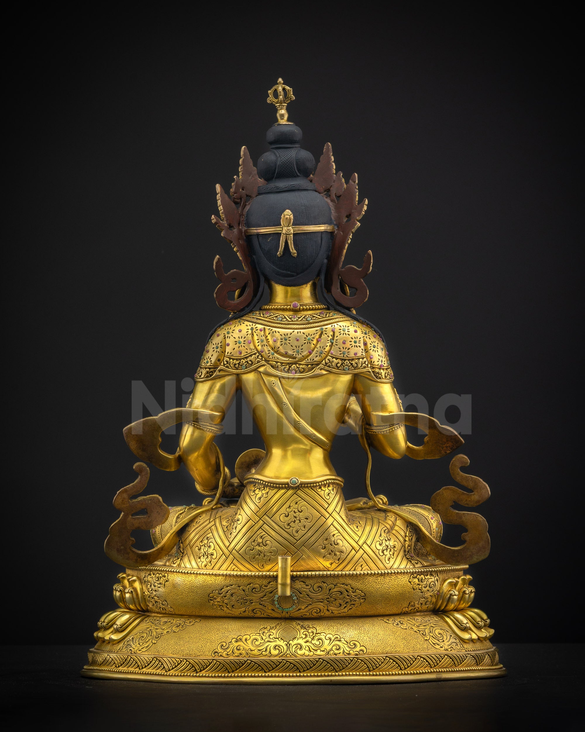 Back view of Vajrasattva statue highlighting patterned lower garments