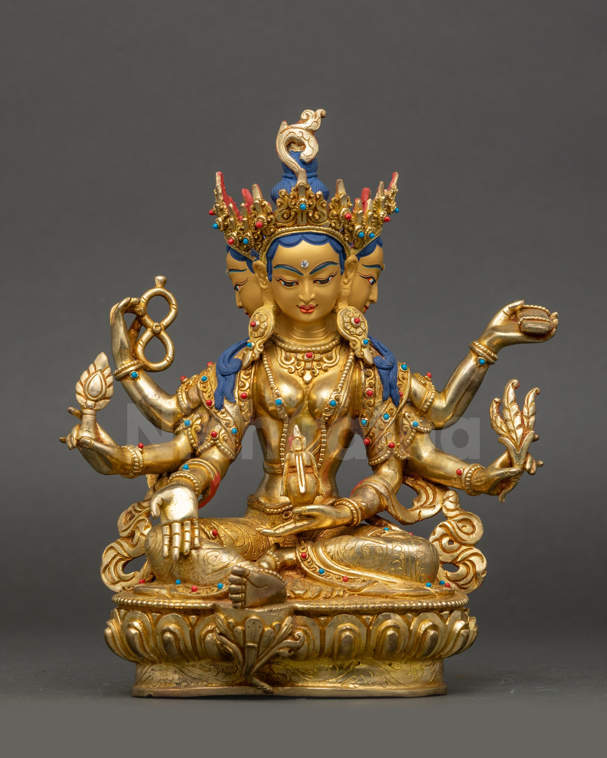 Vasudhara Golden Tara Statue front view with gold-gilded faces and lotus base