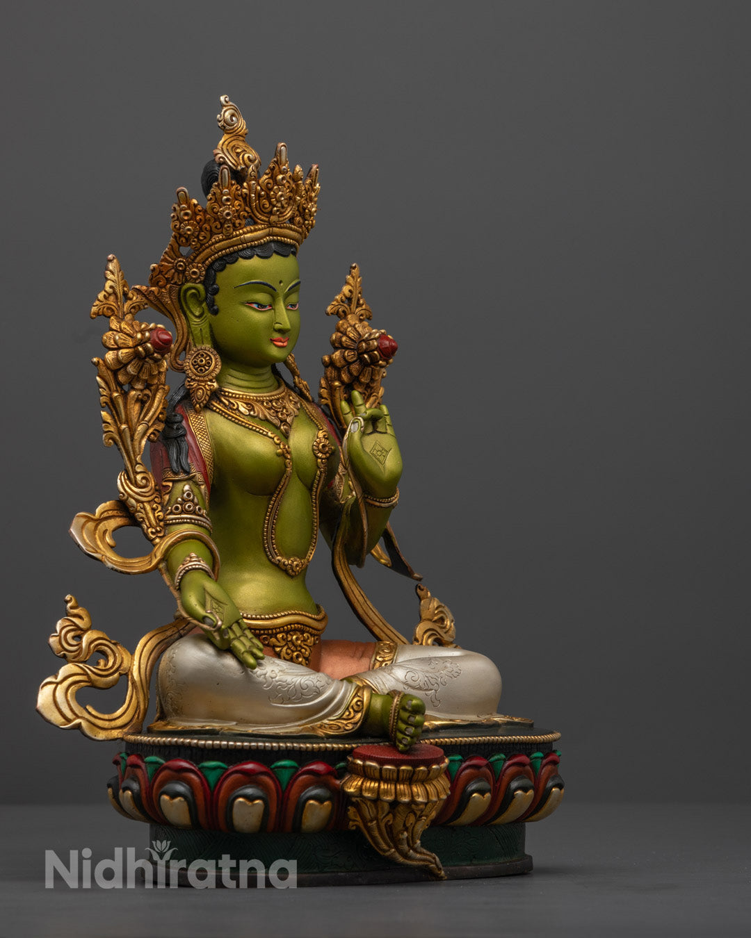 Vibrant Green Tara statue symbolizing compassion and protection