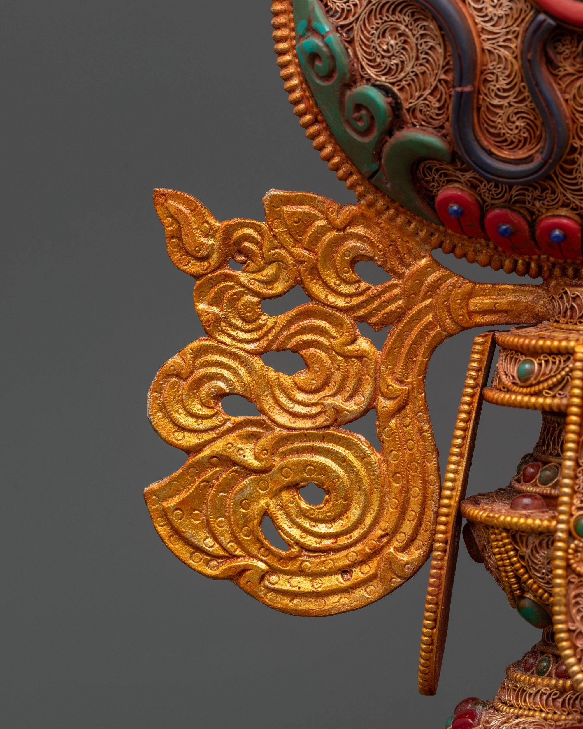 Wheel of Dharma on Ornate Kalash Base Symbolizing Enlightenment and Wisdom