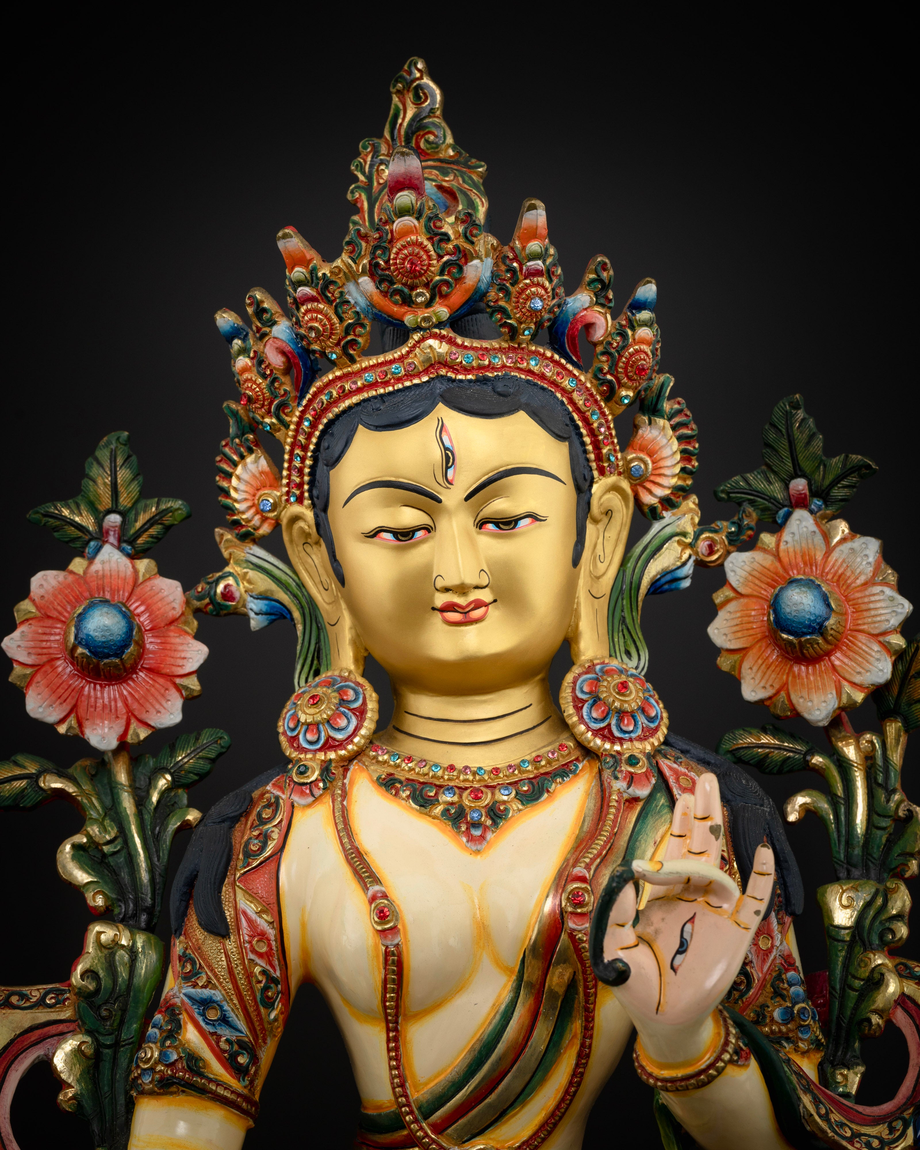White Tara statue’s gold-accented robes and colorful lotus pedestal, highlighting the vibrant craftsmanship of Nepalese artisans.