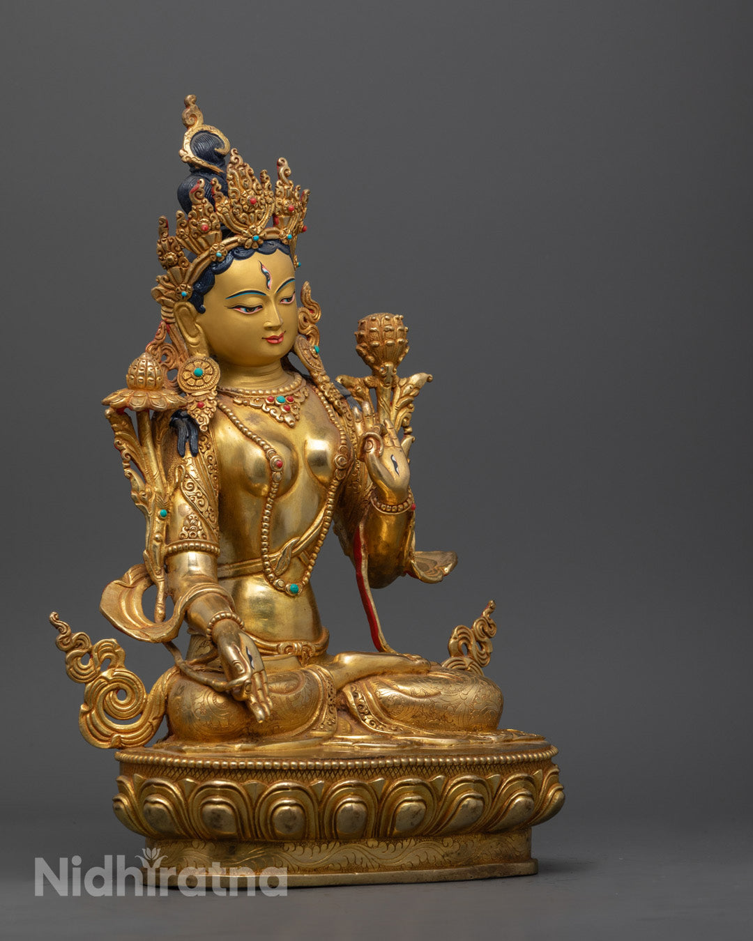 White Tara Bodhisattva statue highlighting the fire-gilded golden copper craftsmanship and lotus base detailing