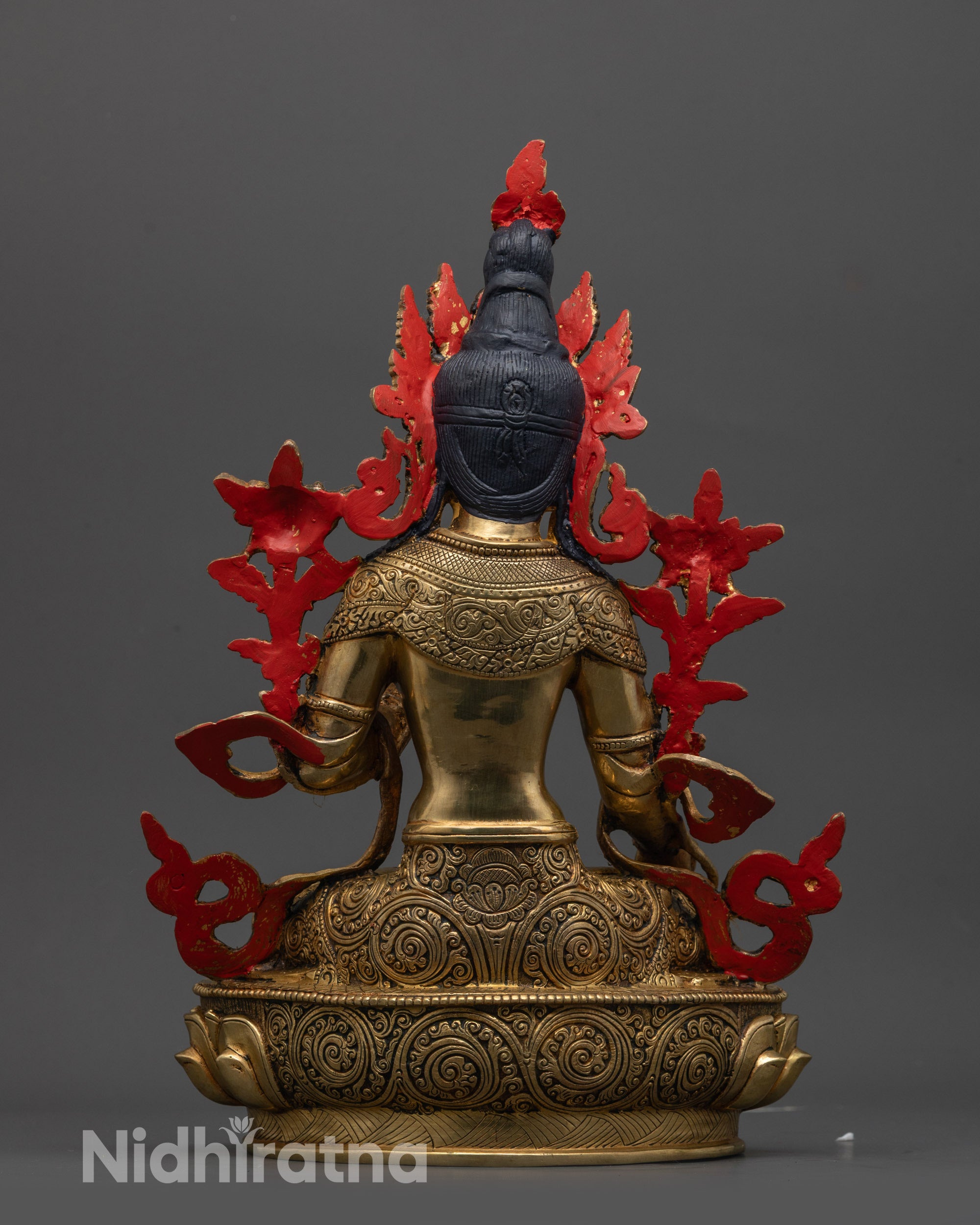 White Tara Statue back view displaying intricate craftsmanship and flowing robes