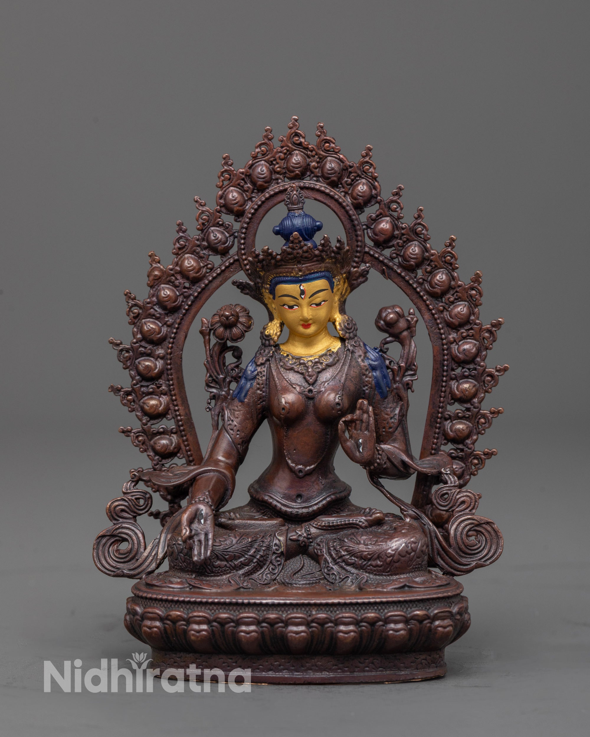 White Tara Statue front view showing gold-plated face and oxidized copper body with halo