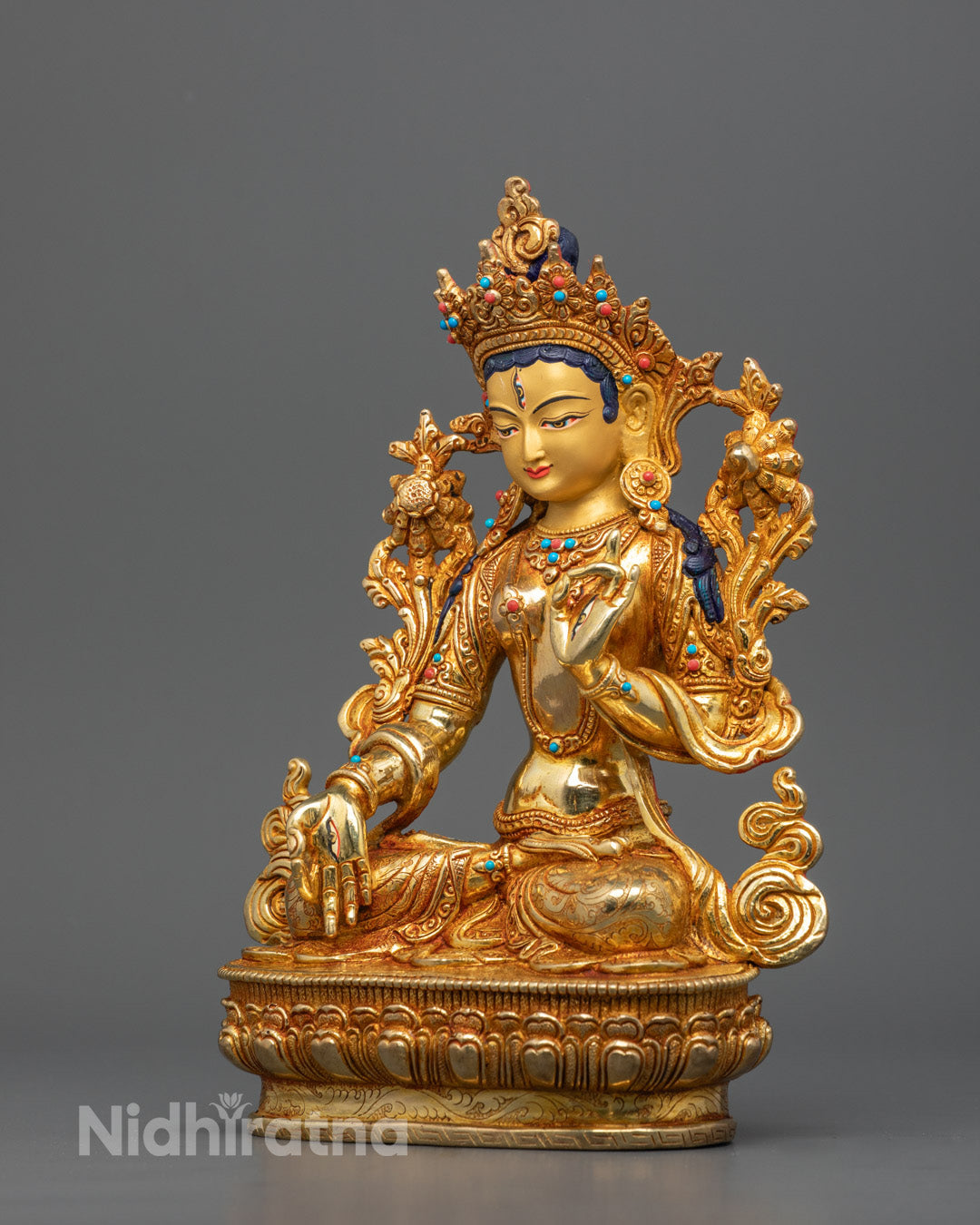 Goddess White Tara's serene face with delicate features and 24K gold plating, radiating purity and divine compassion.