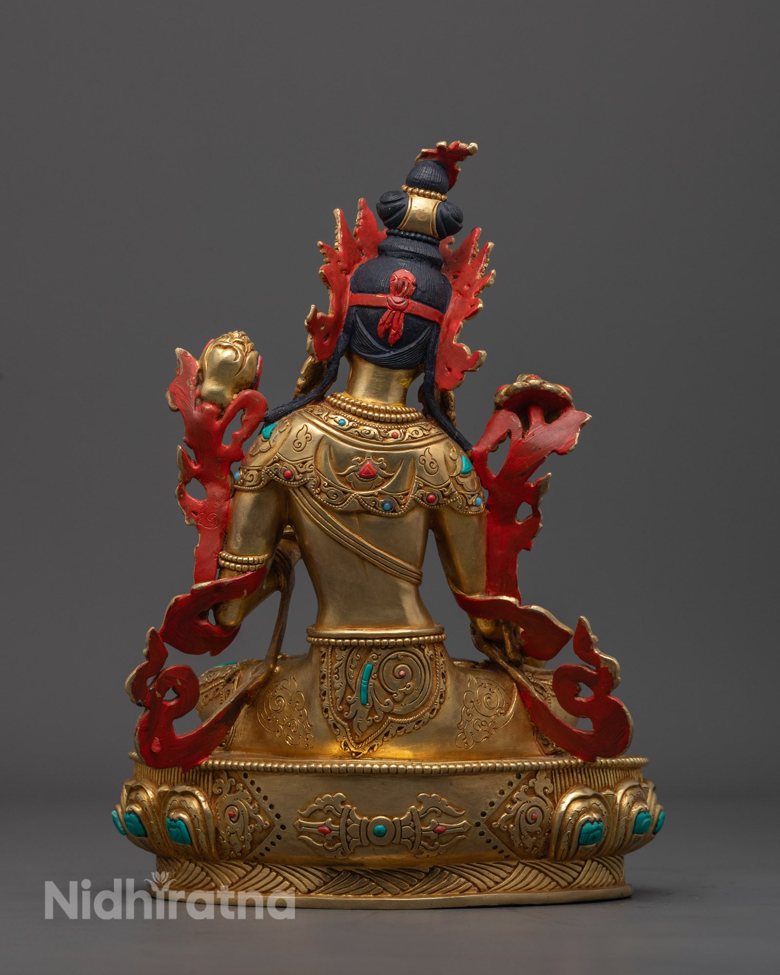 White Tara statue placed on a meditation altar, glowing with radiant 24k gold finish and vibrant acrylic colors.