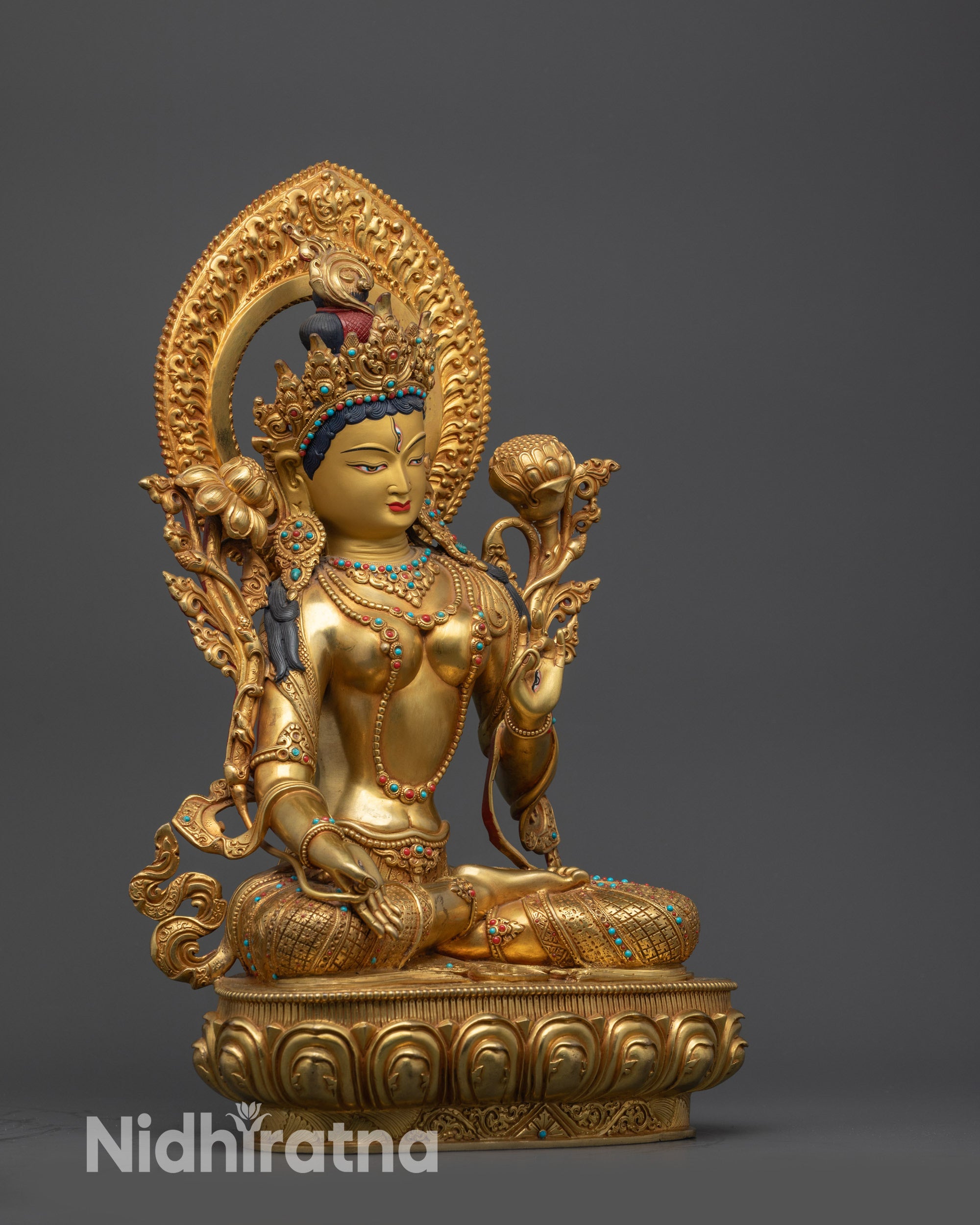 White Tara statue right side view with utpala flower and lotus seat