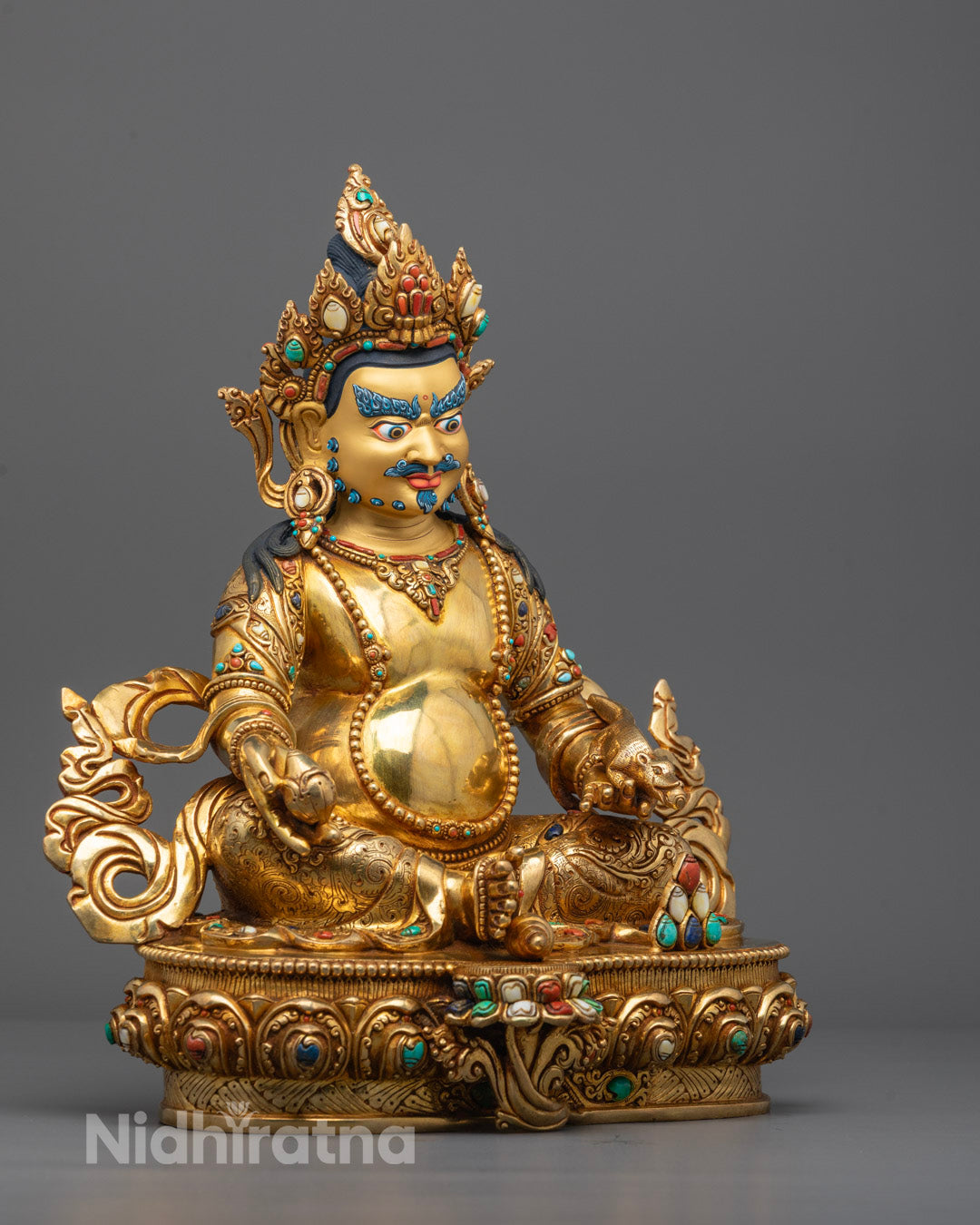 Side View of Dzambhala Seated on Lotus Base in Meditative Posture