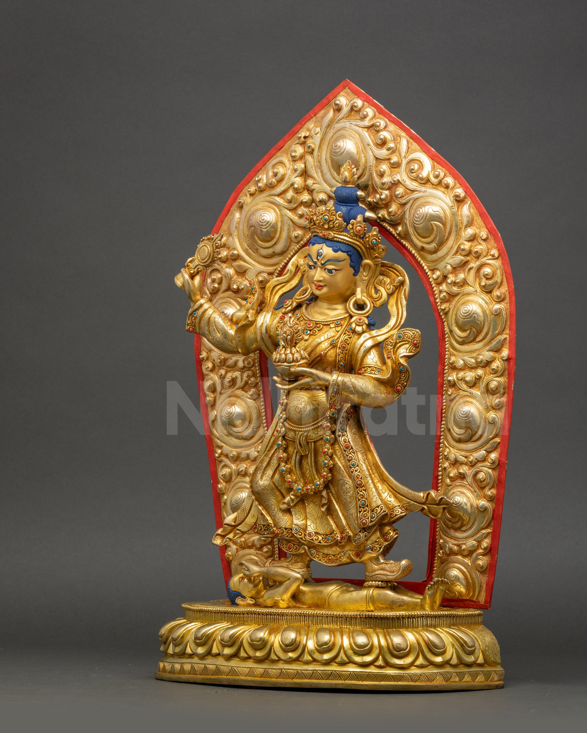 Handcrafted Achi Chokyi Drolma statue standing on lotus seat subduing negative forces