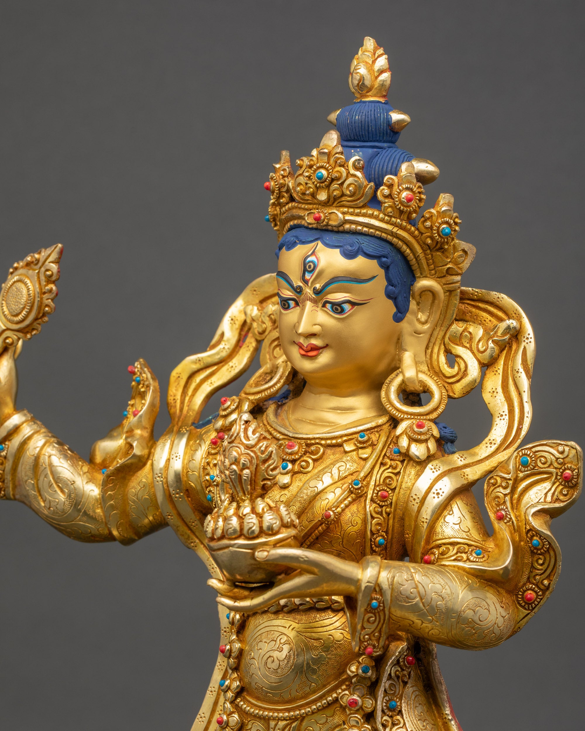 Detailed side close up of Achi Chokyi Drolma statue showing carved garments and ornaments