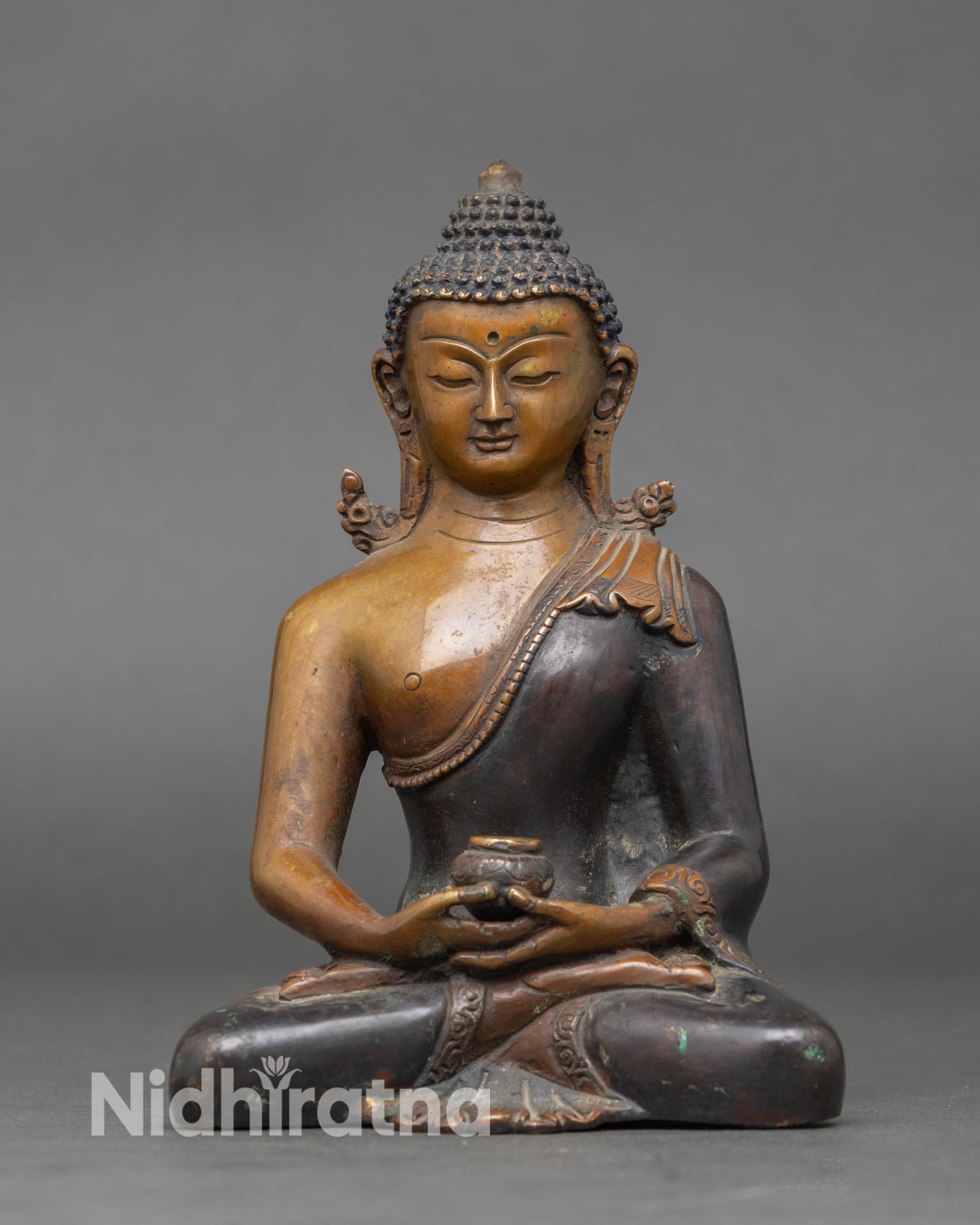 Amitabha Buddha statue meditation posture with begging bowl symbolizing infinite compassion Pure Land and boundless light oxidized copper Vajrayana art