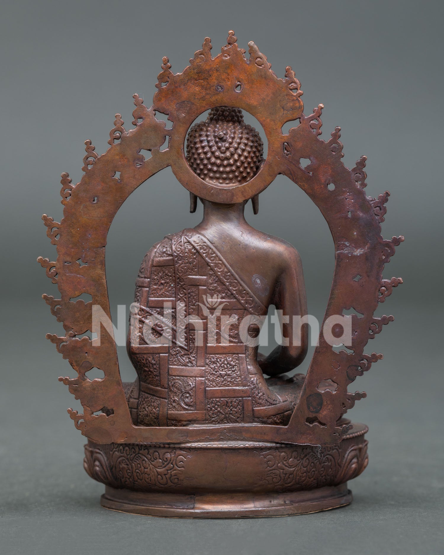 Amitabha Buddha sculpture from Patan Nepal featuring lotus seat oxidized copper details and sacred design