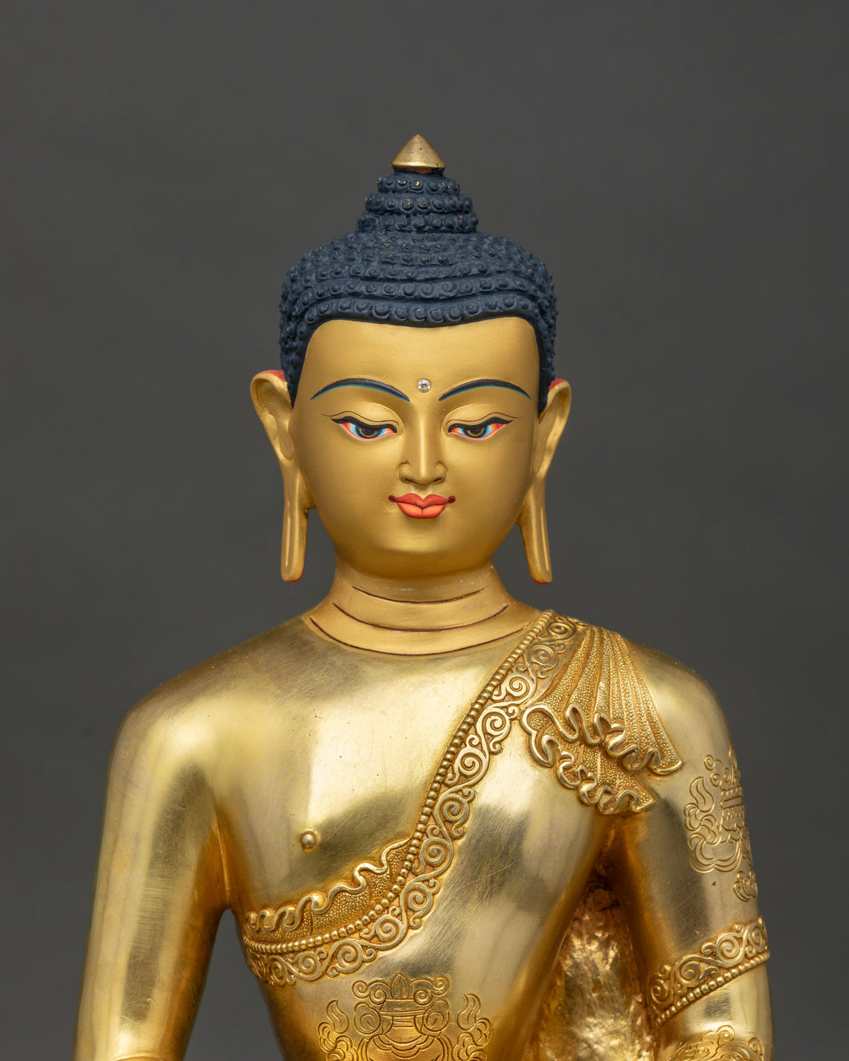 Amitabha Buddha Statue close up engraved auspicious symbols on robe.