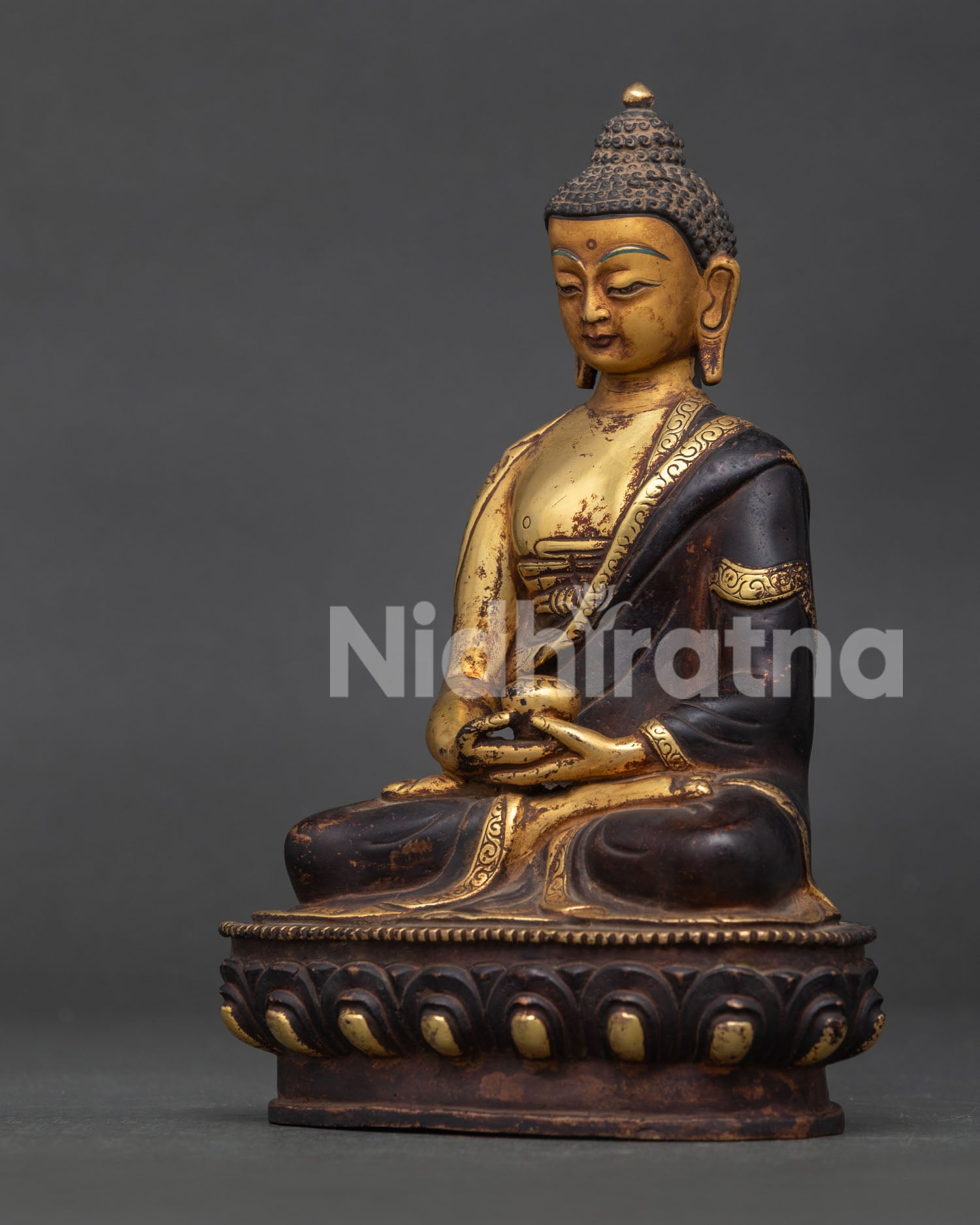 Amitabha Buddha Statue Detail Showing Handcarved Monk’s Robe and Serene Face.
