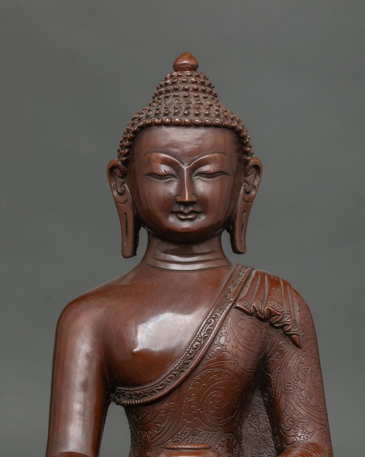 Amitabha Buddha statue in dhyana mudra holding traditional alms bowl.