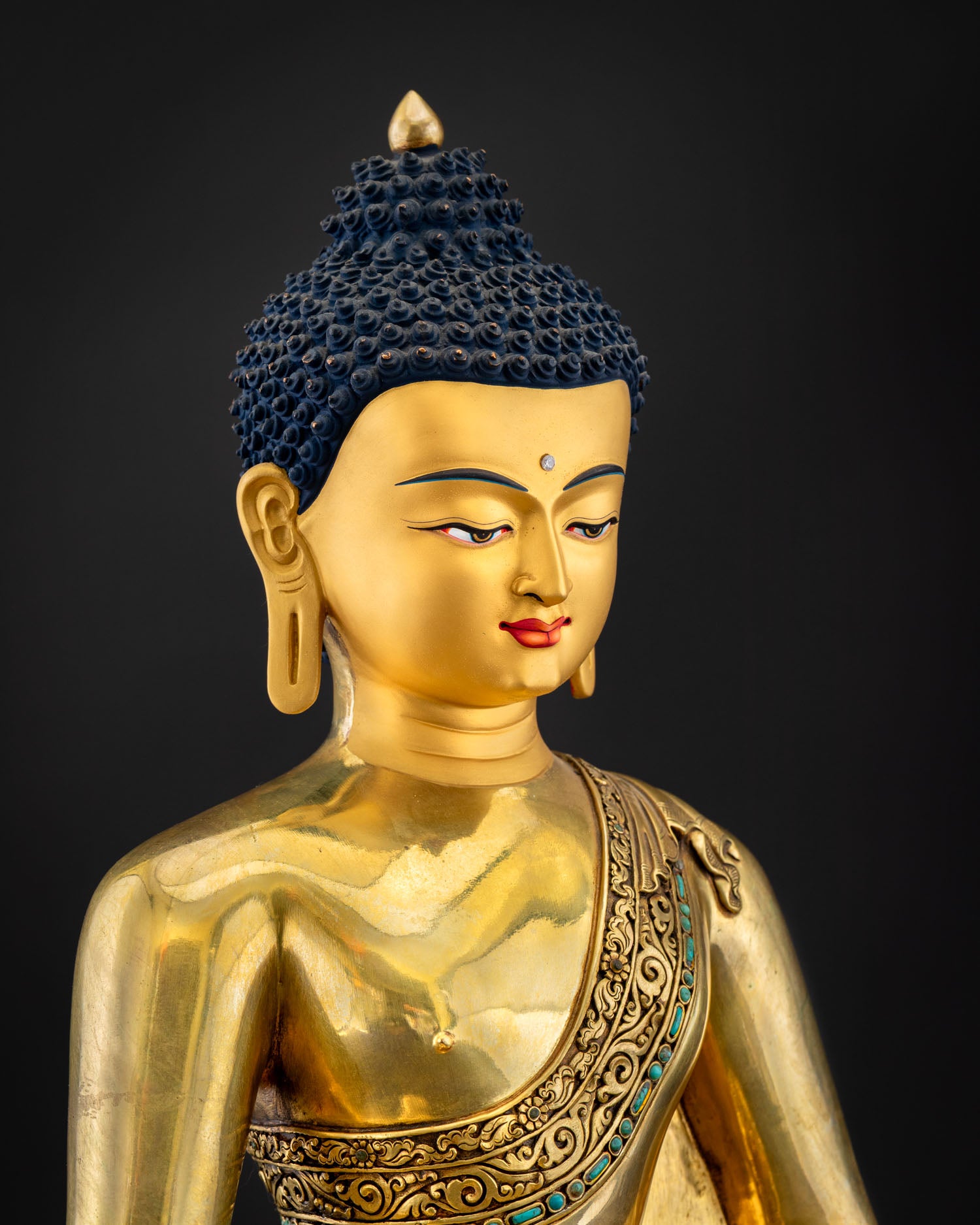 Amitabha Buddha statue three-quarter face, gold features, Urna on forehead, blue Ushnisha, Nepal