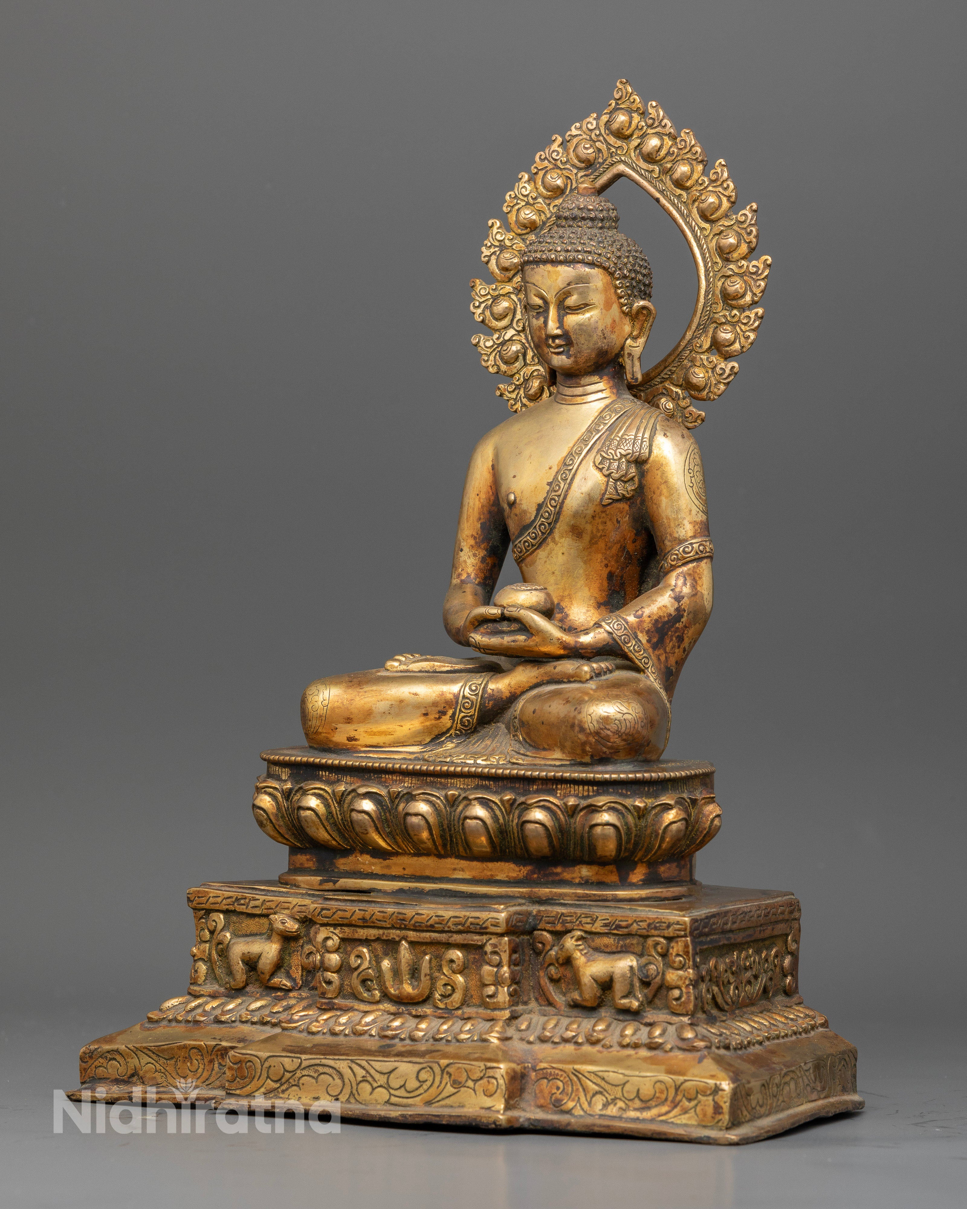 Amitabha Buddha statue with elephant vajra throne and rising halo.