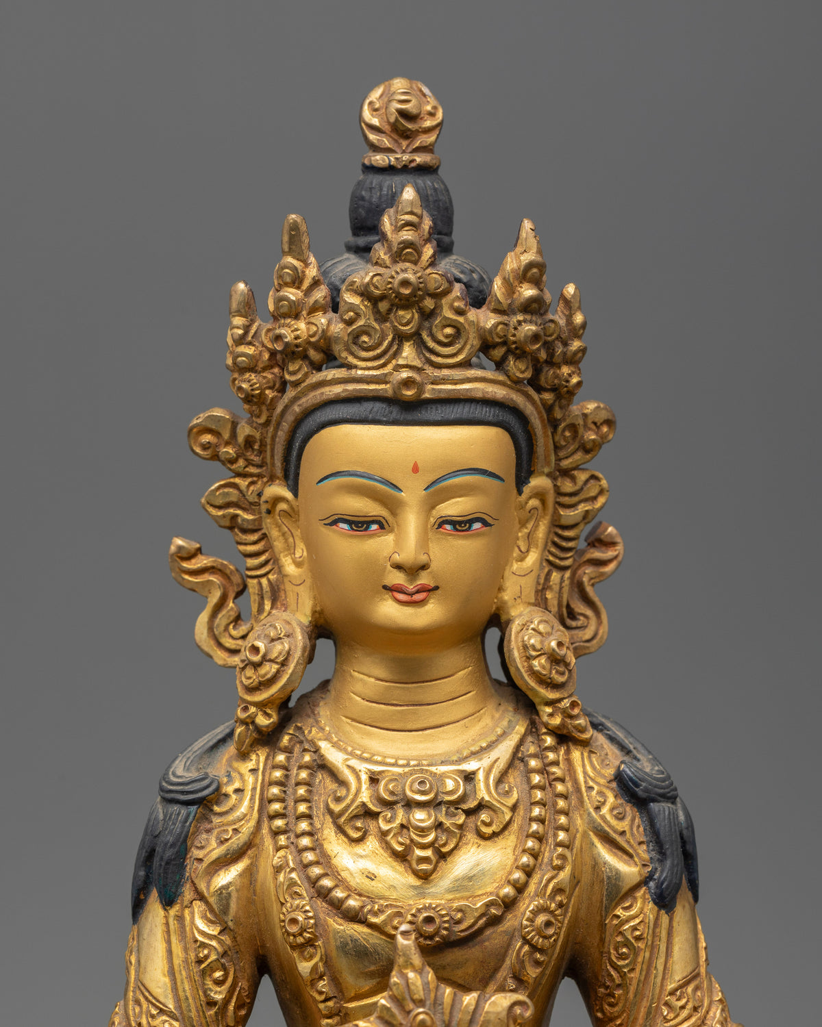 Amitayus Buddha statue featuring a five jewel crown and ornate golden jewelry.