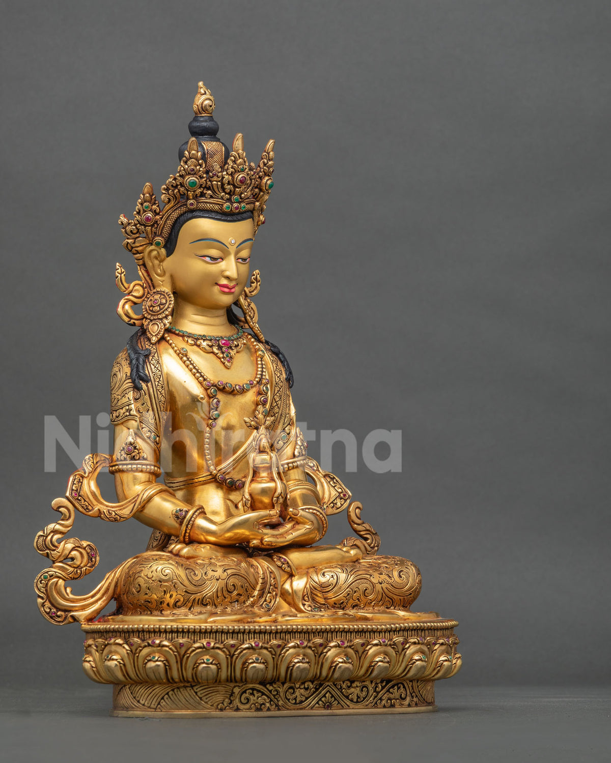 Amitayus Buddha statue right side view holding long-life vase on lotus throne