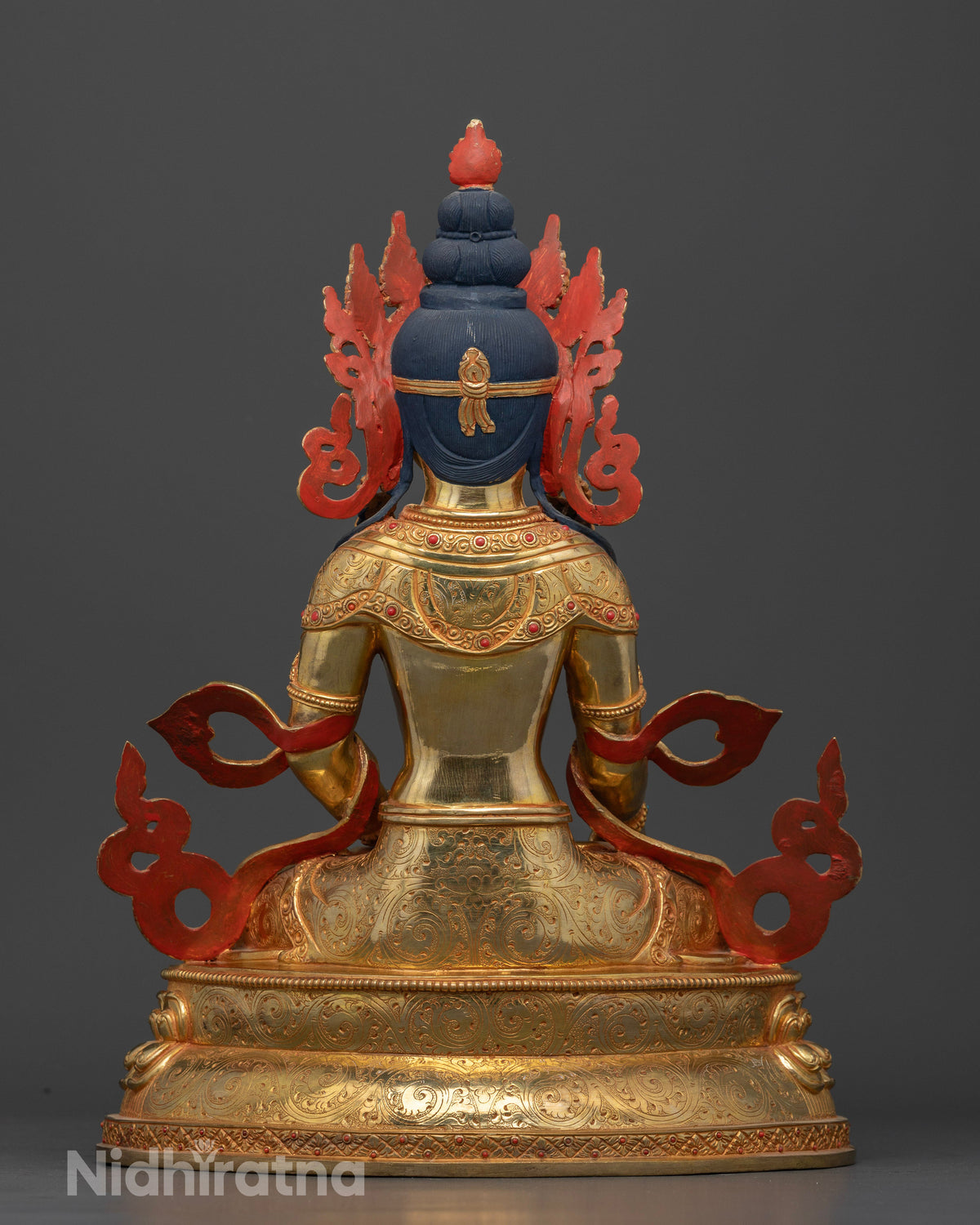 Amitayus Buddha statue with engraved robes and double lotus pedestal.