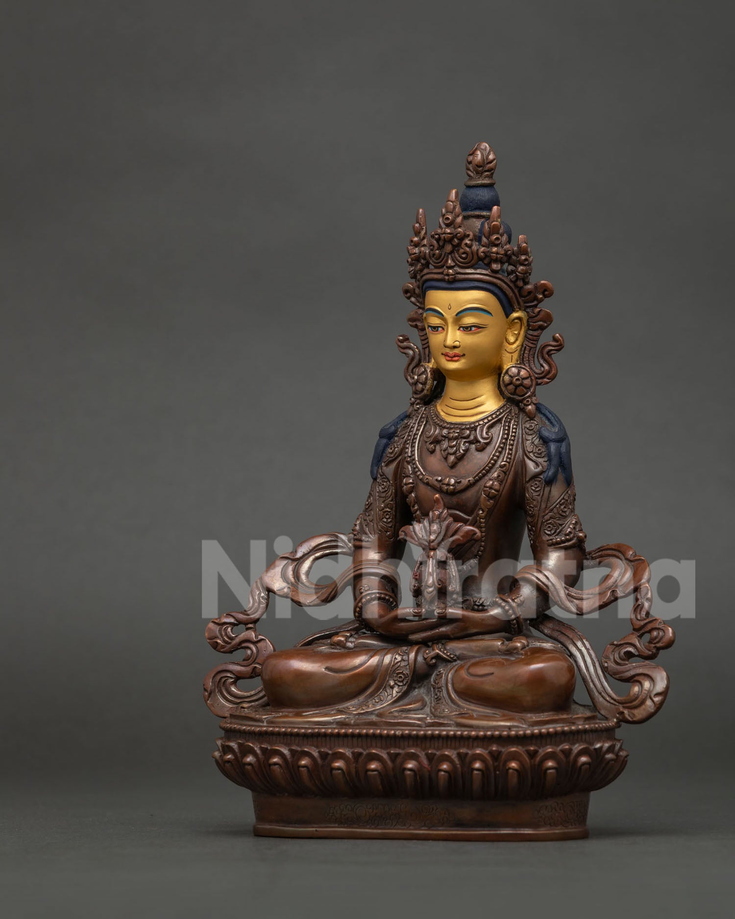 Amitayus Statue Side View Flowing Robe Silk Garment and Oxidized Copper Finish.