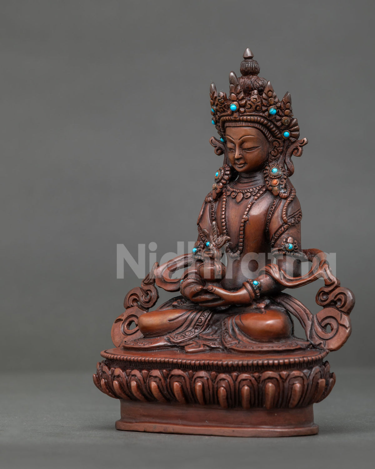 Amitayus statue with five jewel crown flowing robe and semi precious stones.