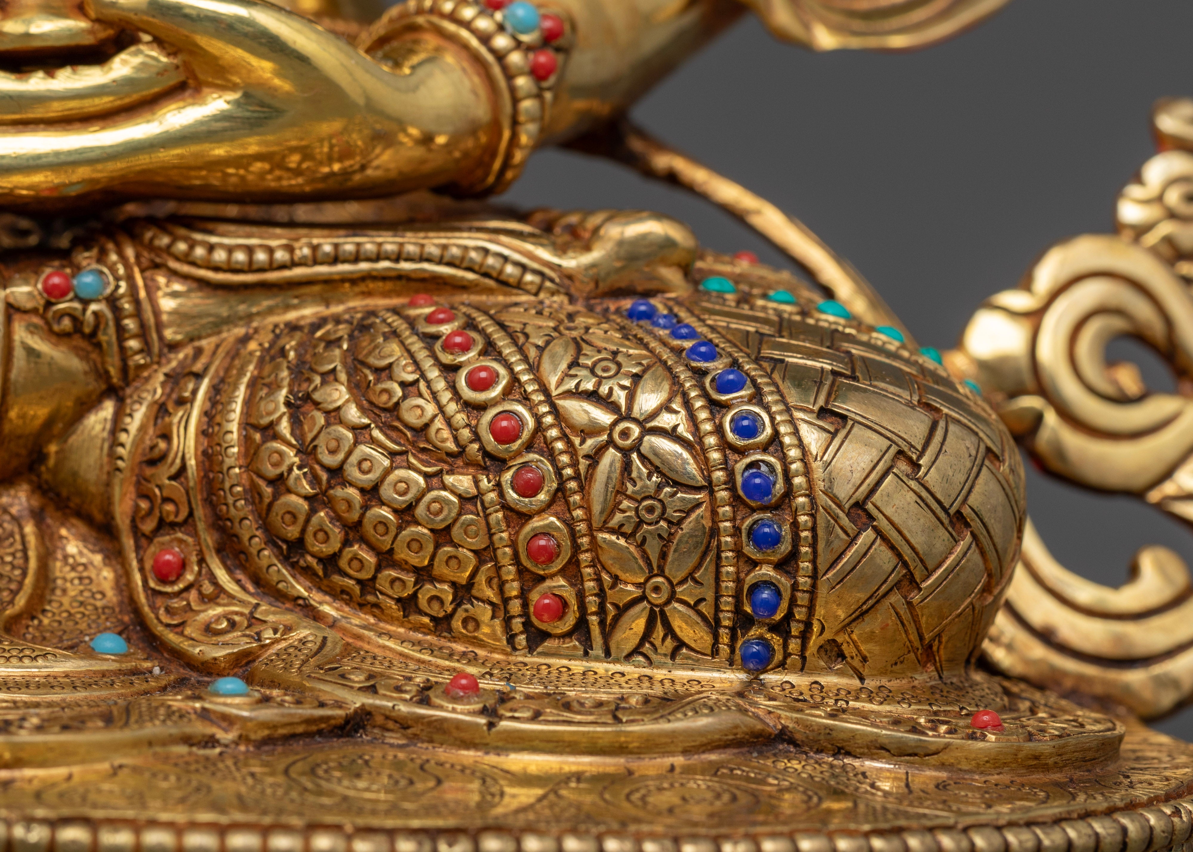 crossed leg of amitayus buddha statue adorned with gemstones