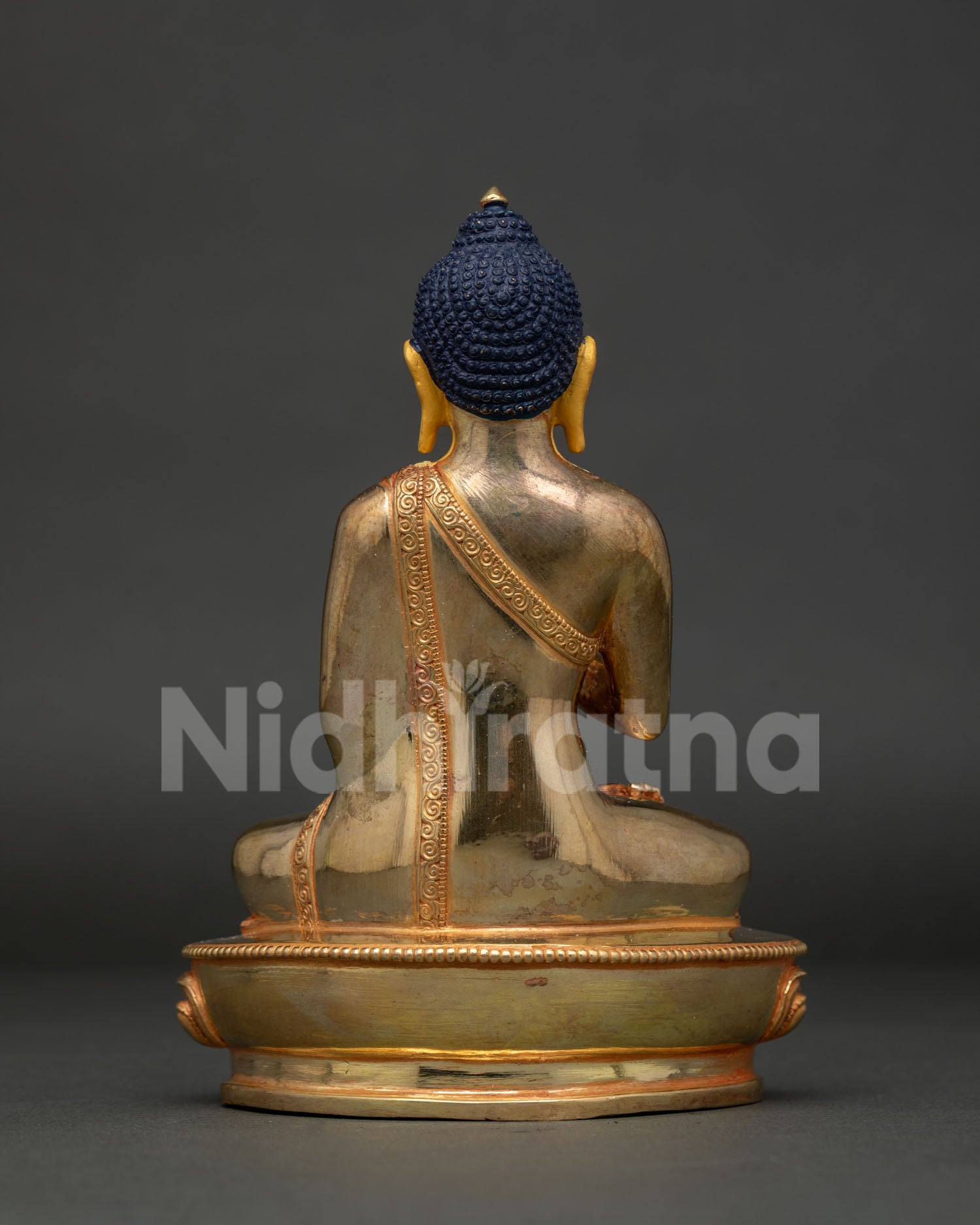 Amoghasiddhi Buddha statue holding sacred bowl in Abhaya Mudra handcrafted in Nepal.