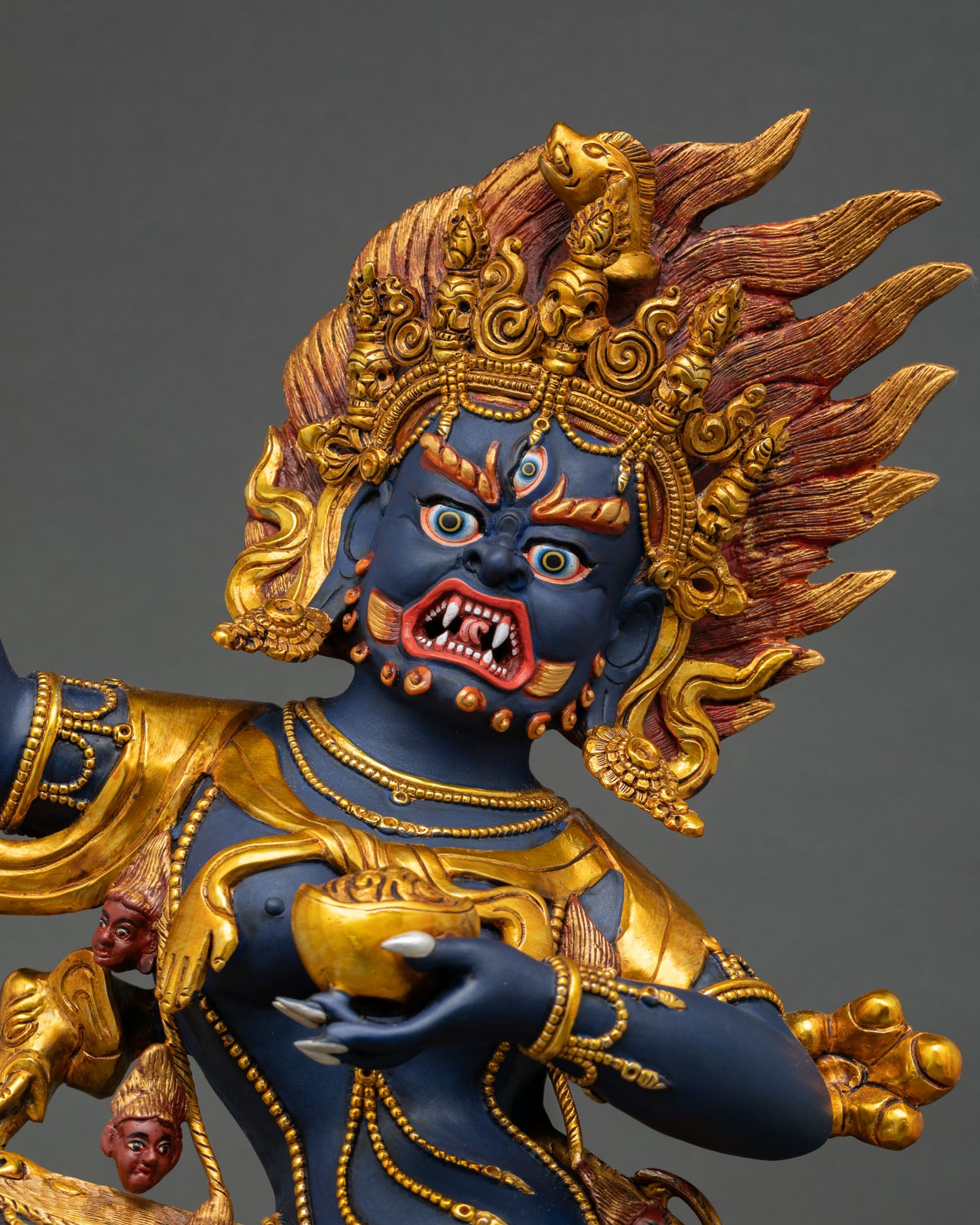 Angled view of handmade Troma Nagmo Statue with intricate gold-gilded Himalayan craftsmanship.