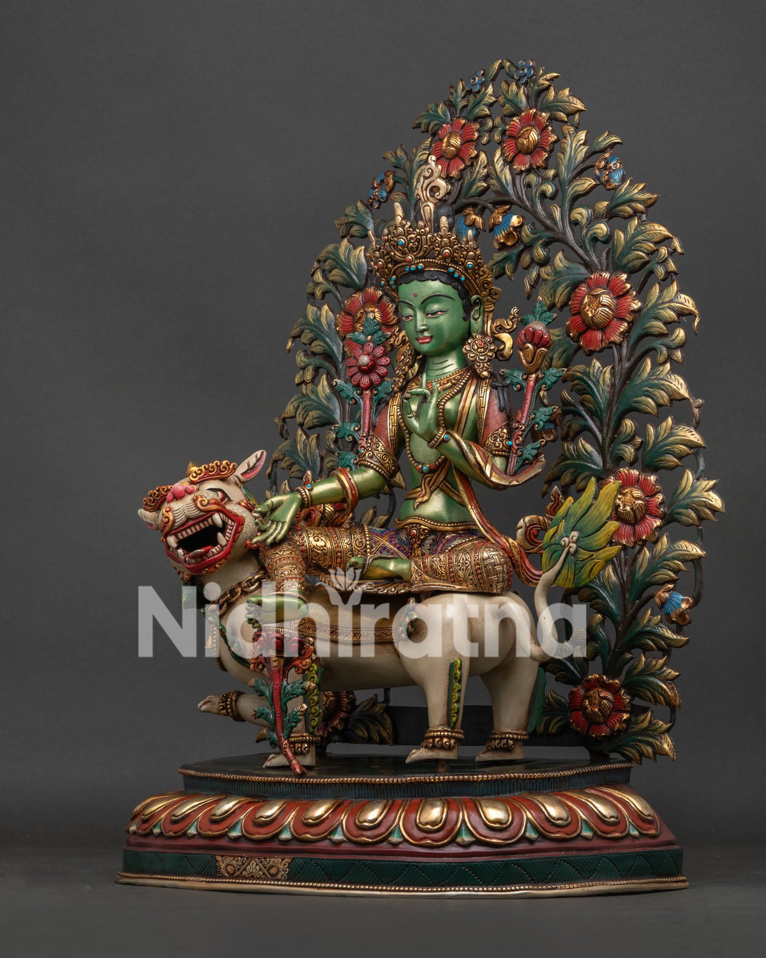 Angled view of Simhanada Tara riding snow lion, handcrafted Nepali Buddhist statue