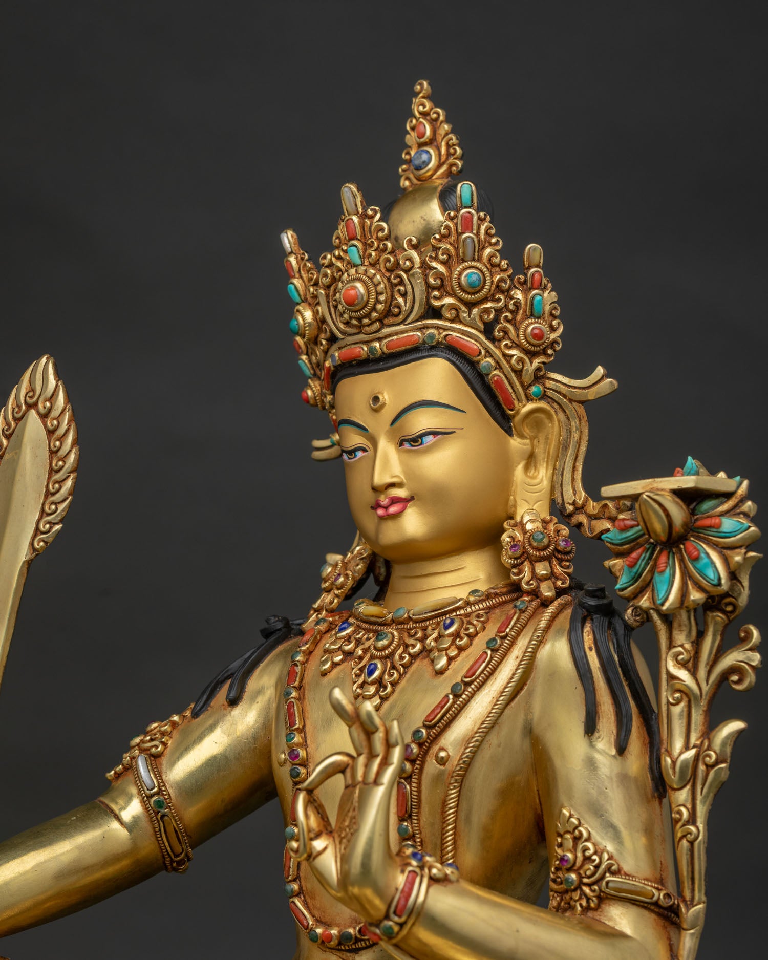 Arapachana Manjushri statue side detail — gold filigree halo and acrylic embellishments Nepal