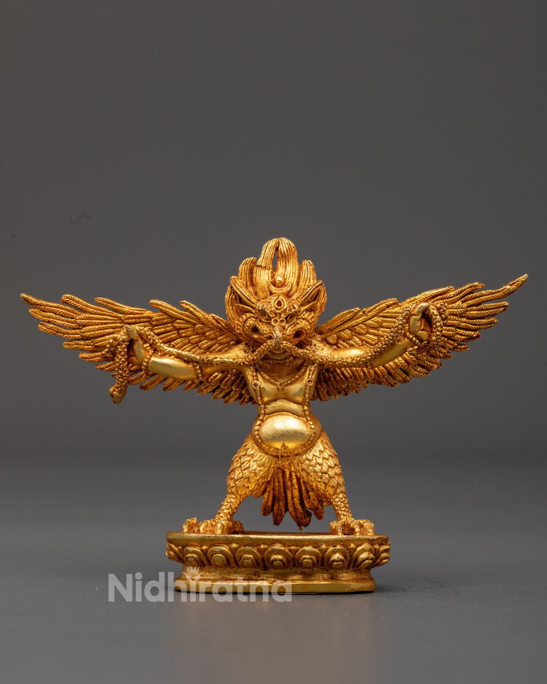 authentic Garuda figurine with 24K gold-gilded face and fire-gilded body, handcrafted using the ancient lost wax method