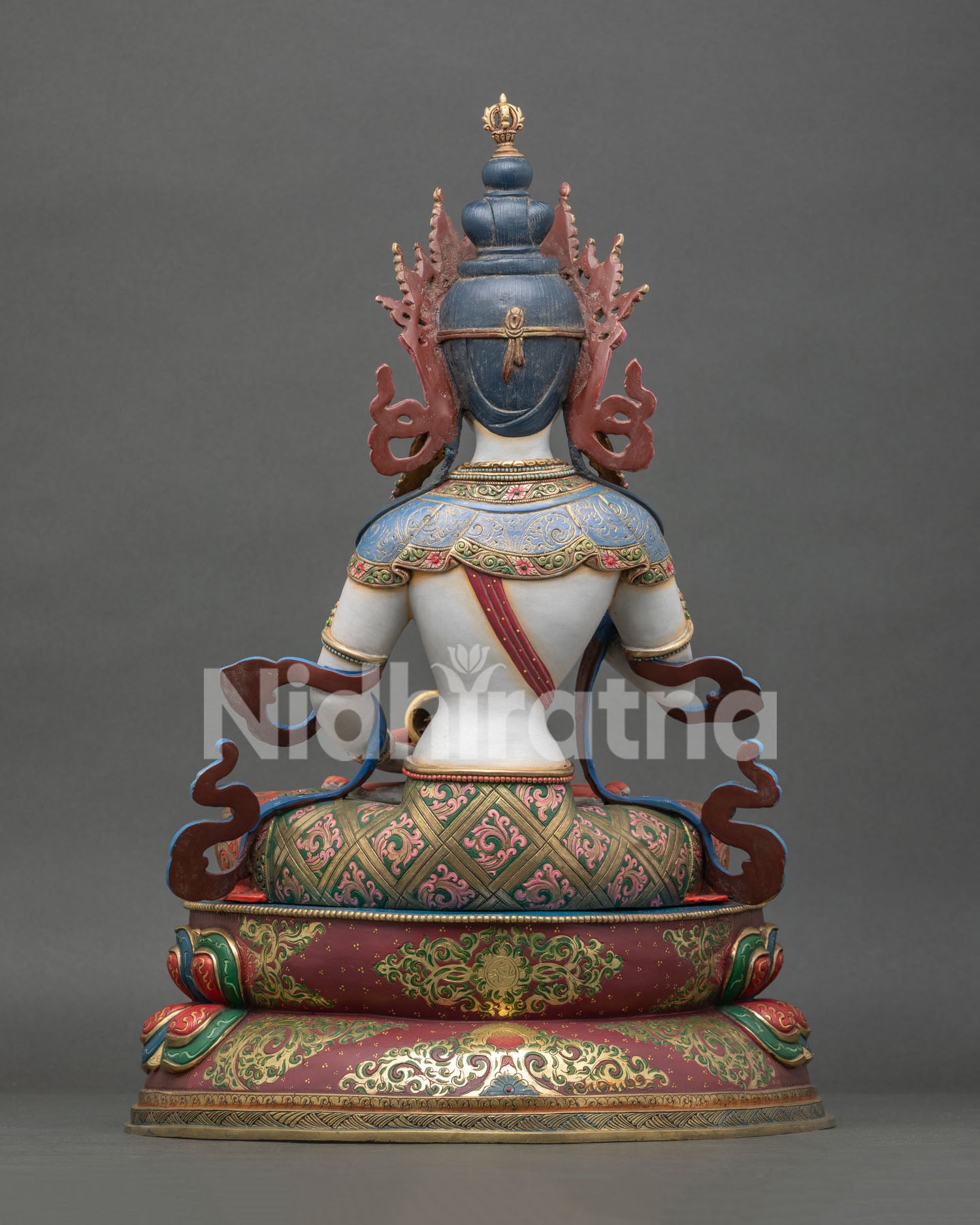 back of vajrasattva statue with engraved robes and lotus base craftsmanship