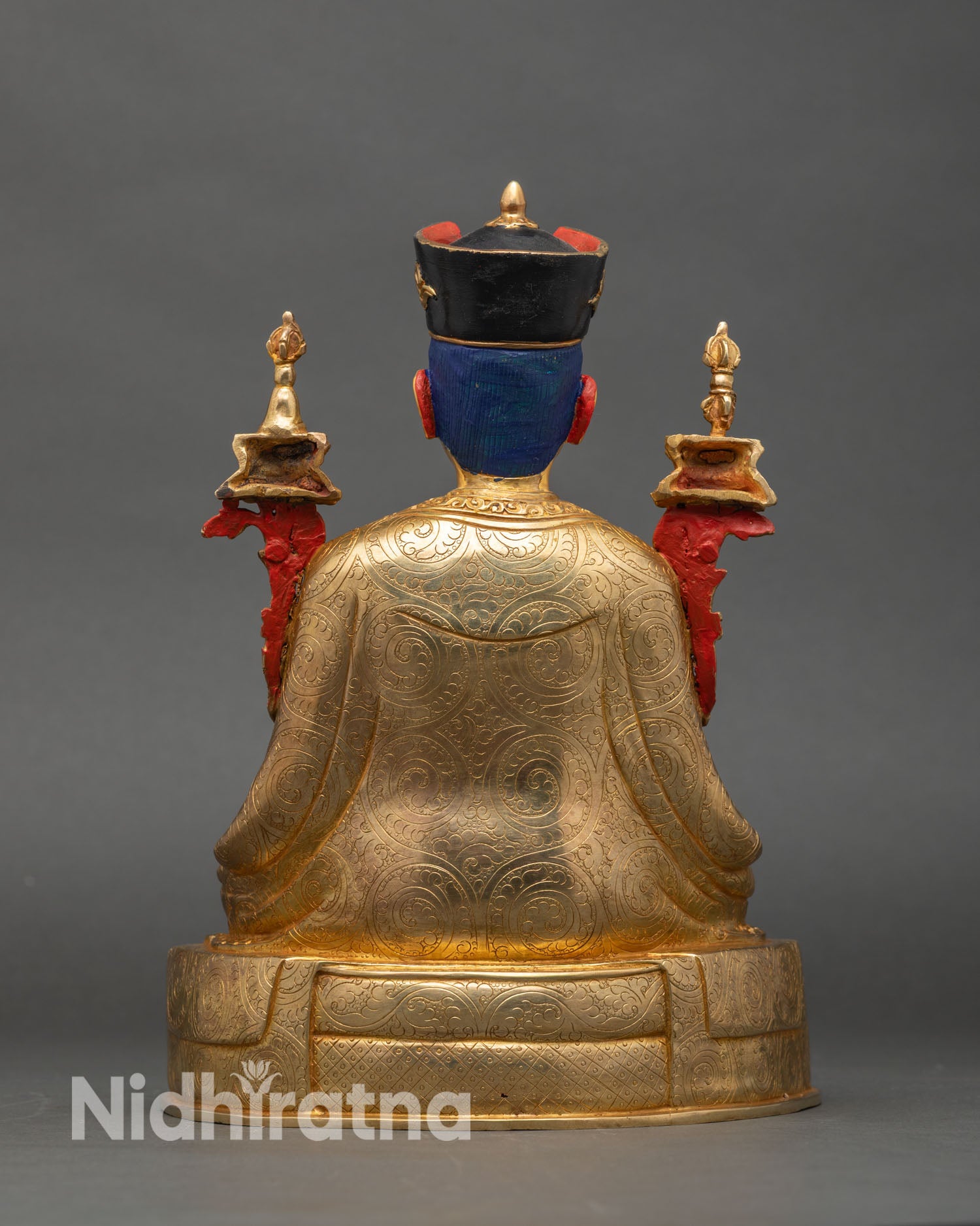 Back view of 3rd Karmapa statue showing detailed robe carvings and throne design