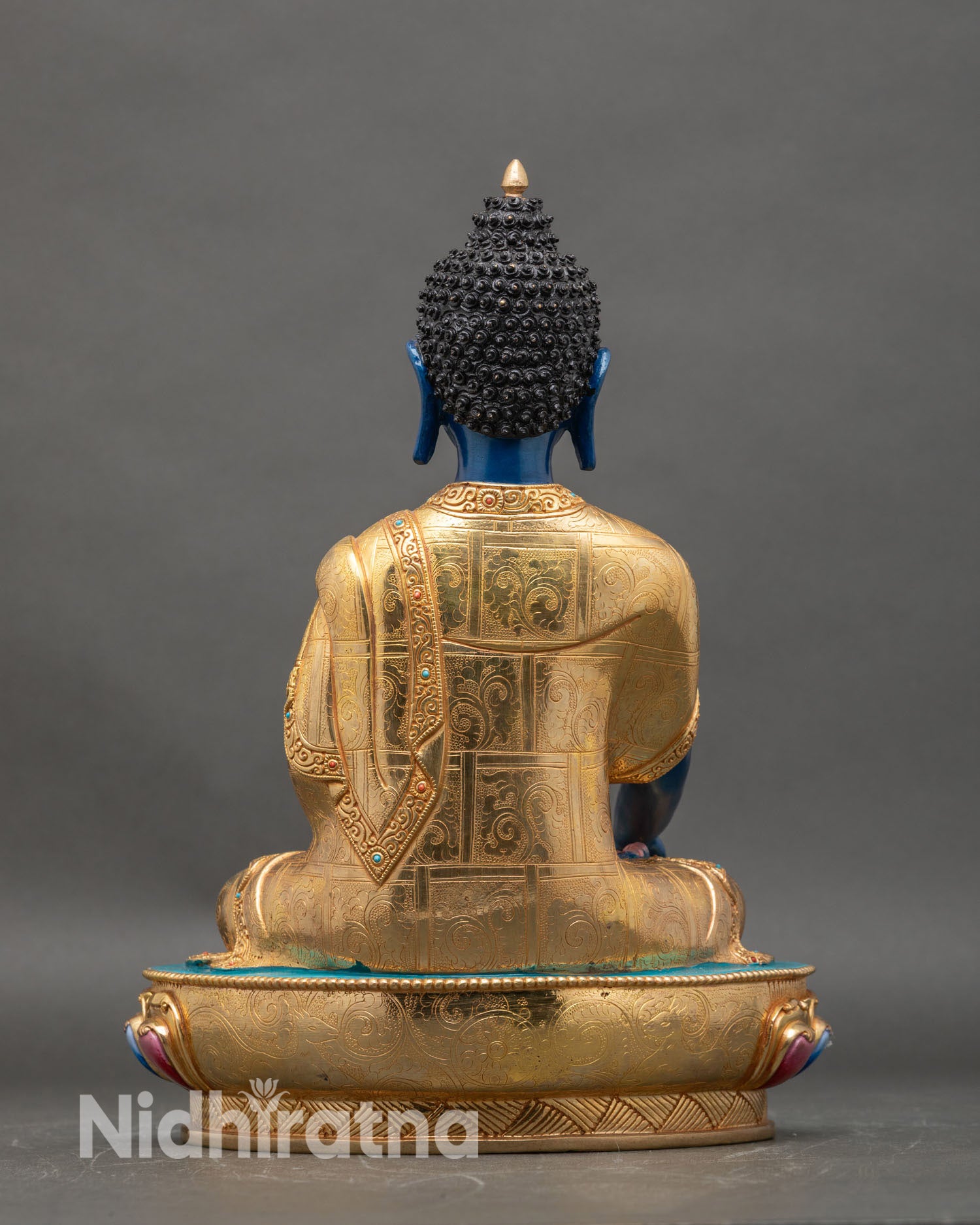 back view of Deep Blue Shakyamuni Buddha statue lotus pedestal intricate gold patterns semi precious stone embellishments