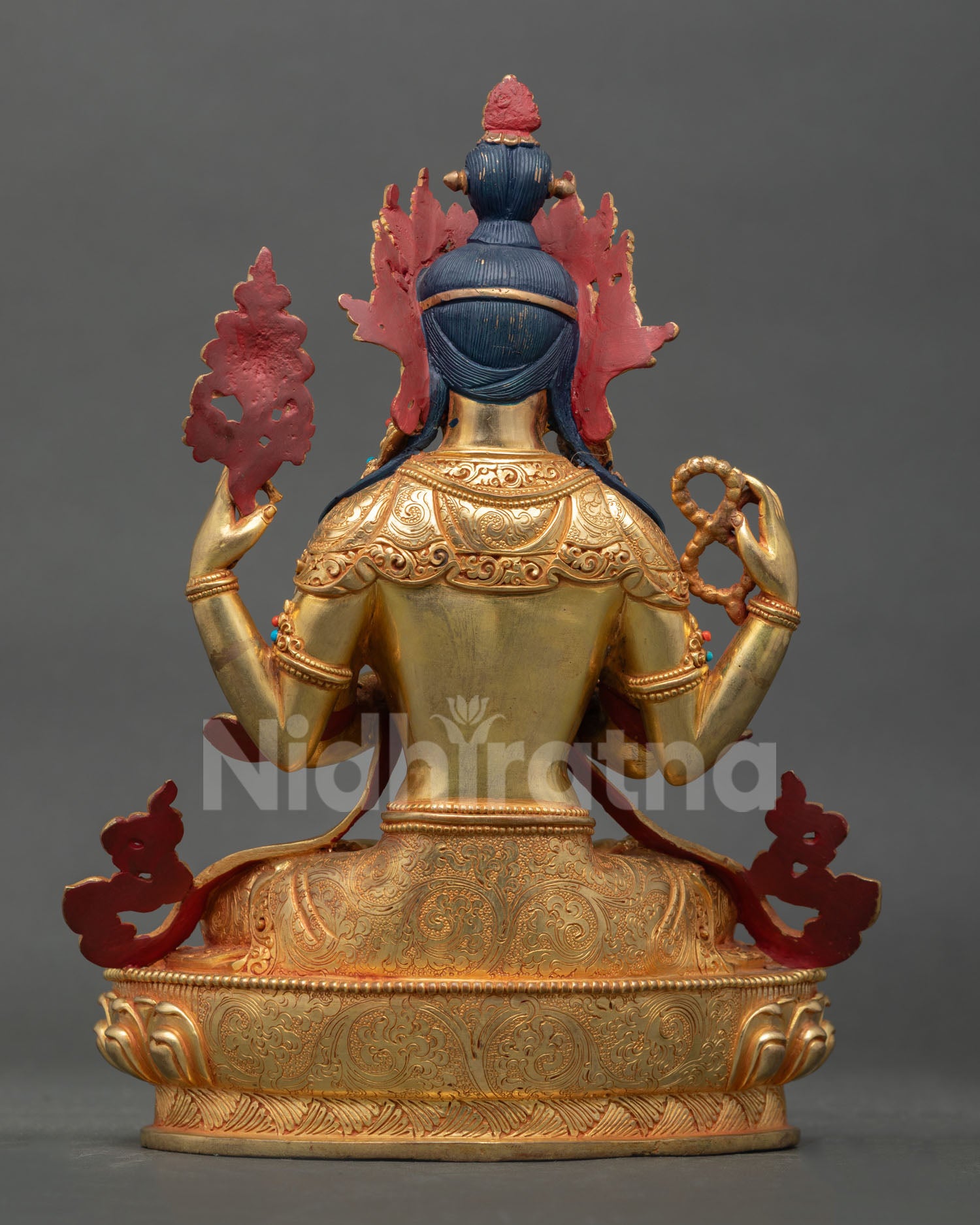 Back view Chenrezig statue with lotus pedestal detailing and traditional Himalayan craftsmanship, Buddhist sculpture Nepal