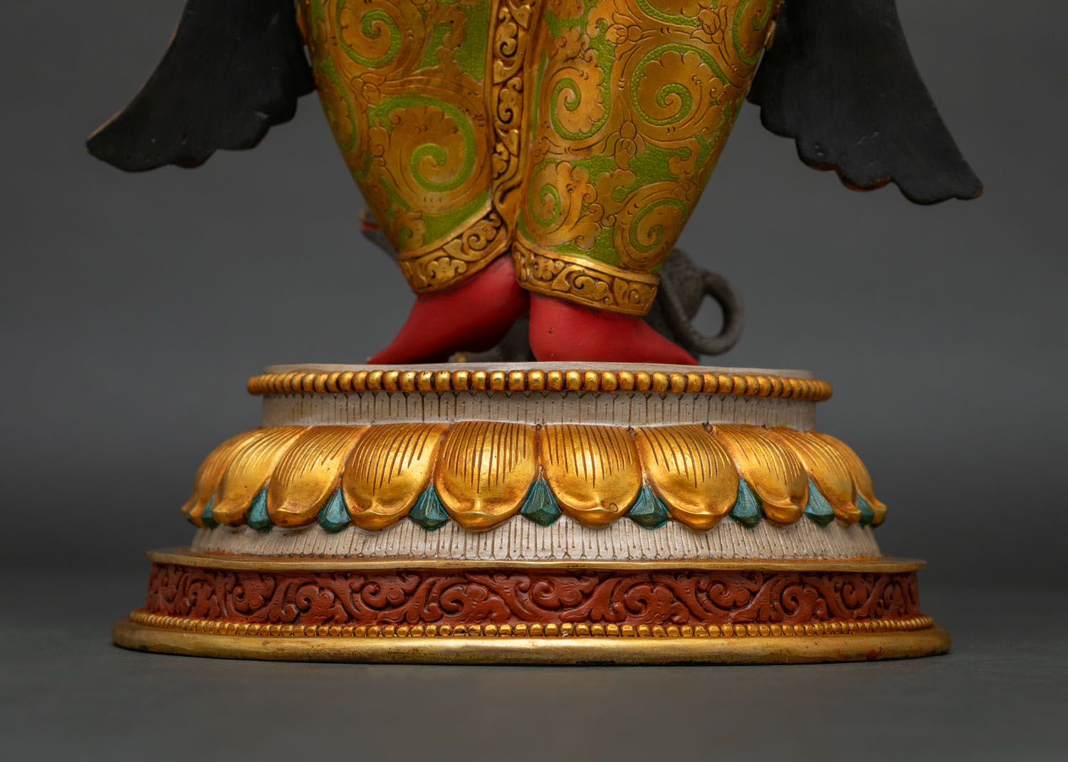 Back view close-up of Ganesha statue lotus pedestal base, gold detailing