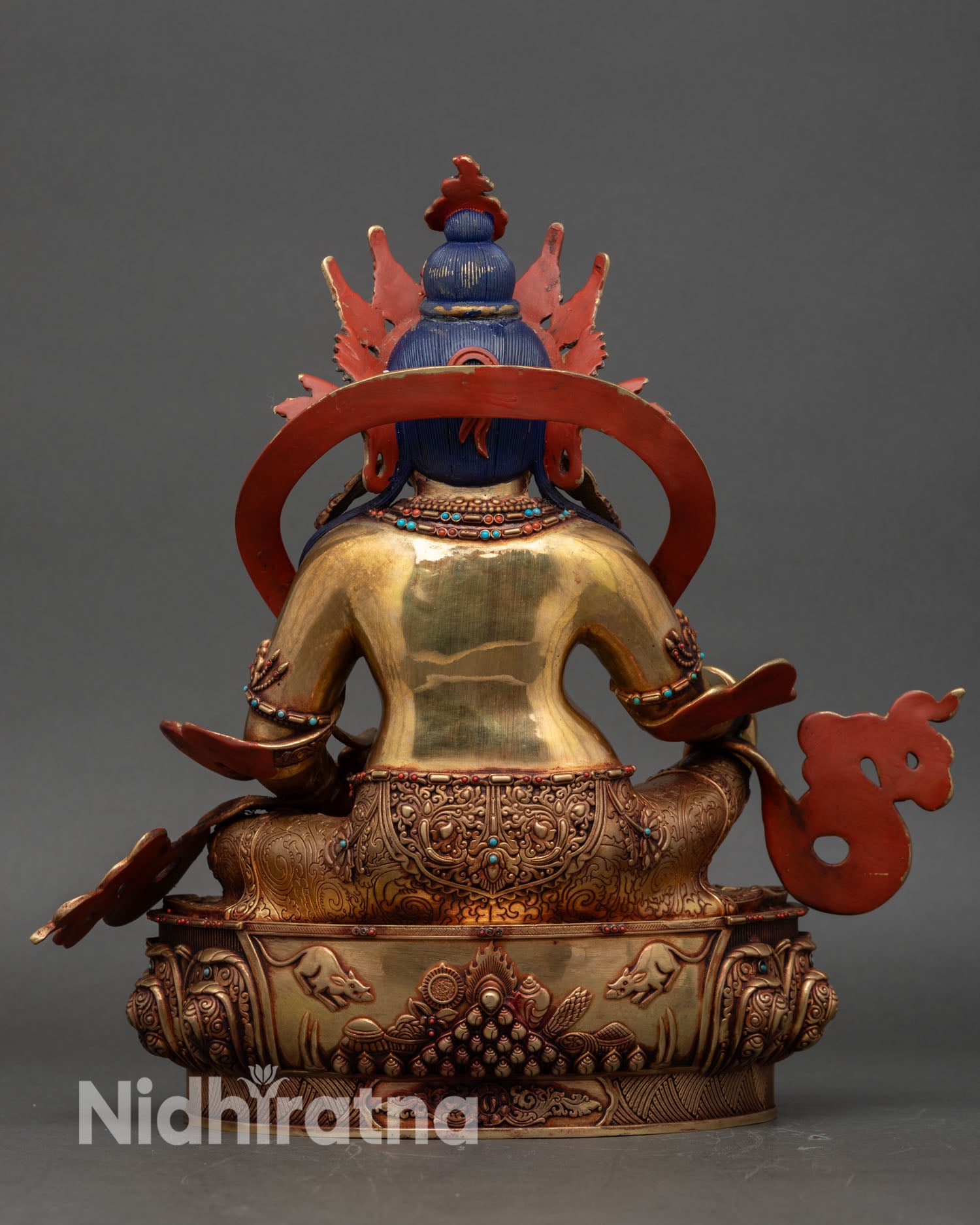 back view dzambhala figurine lotus base detailed carvings and spiritual motifs