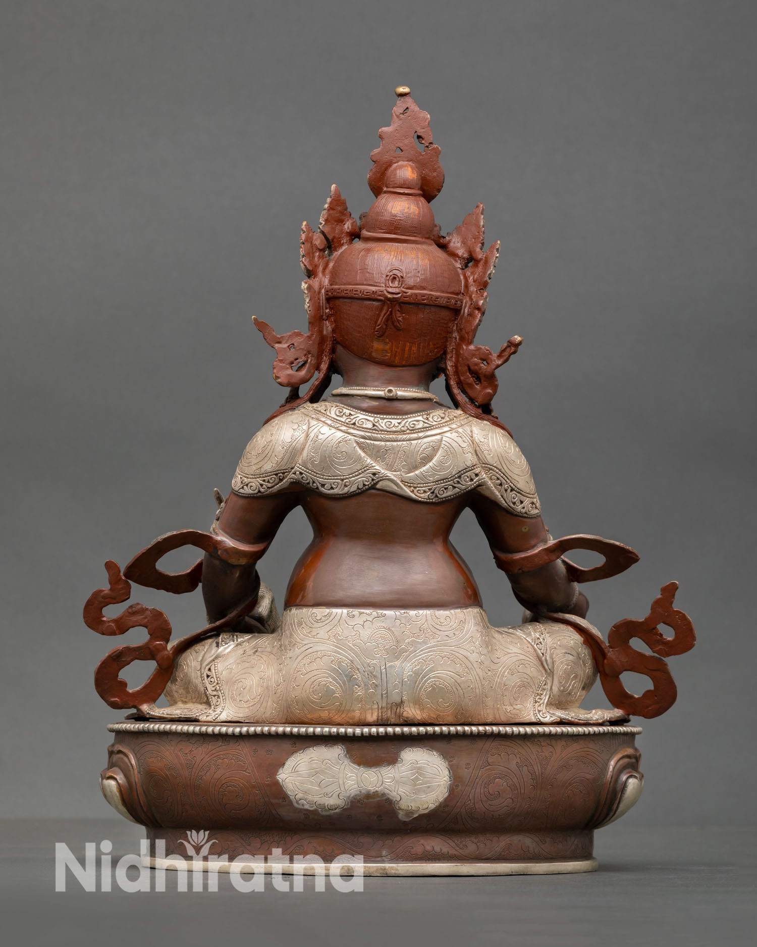 Back view of Dzambhala sculpture detailed craftsmanship oxidized copper finish, Tibetan Buddhist wealth deity