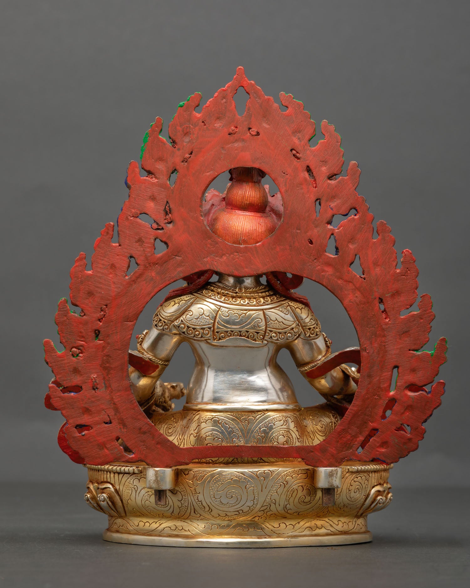 Back view of Dzambhala statue handmade Nepal copper sculpture with gold gilded finish and hand painted acrylic detailing for altar decor