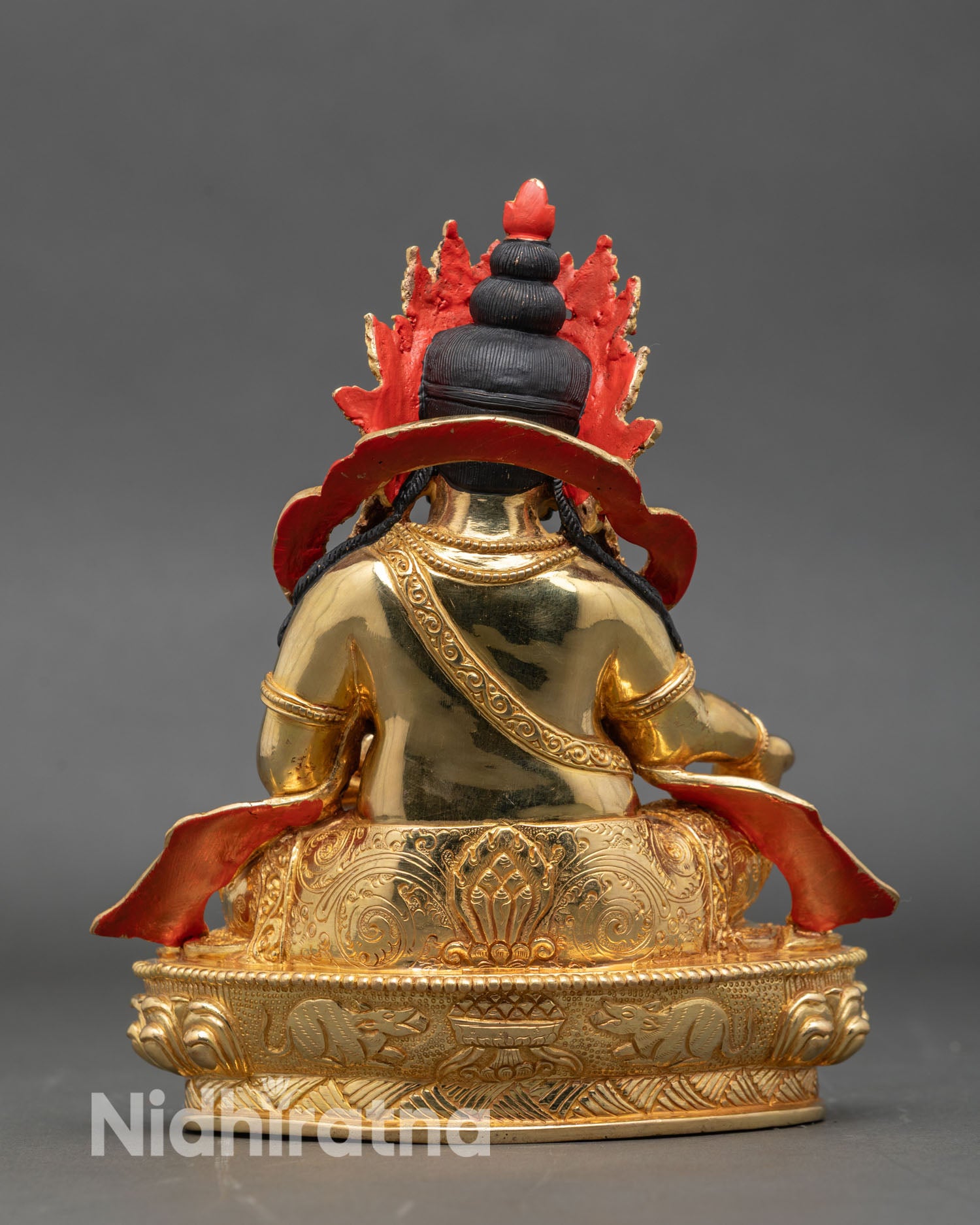 Back view Dzambhala statue ornate halo copper scrollwork hand-set stones