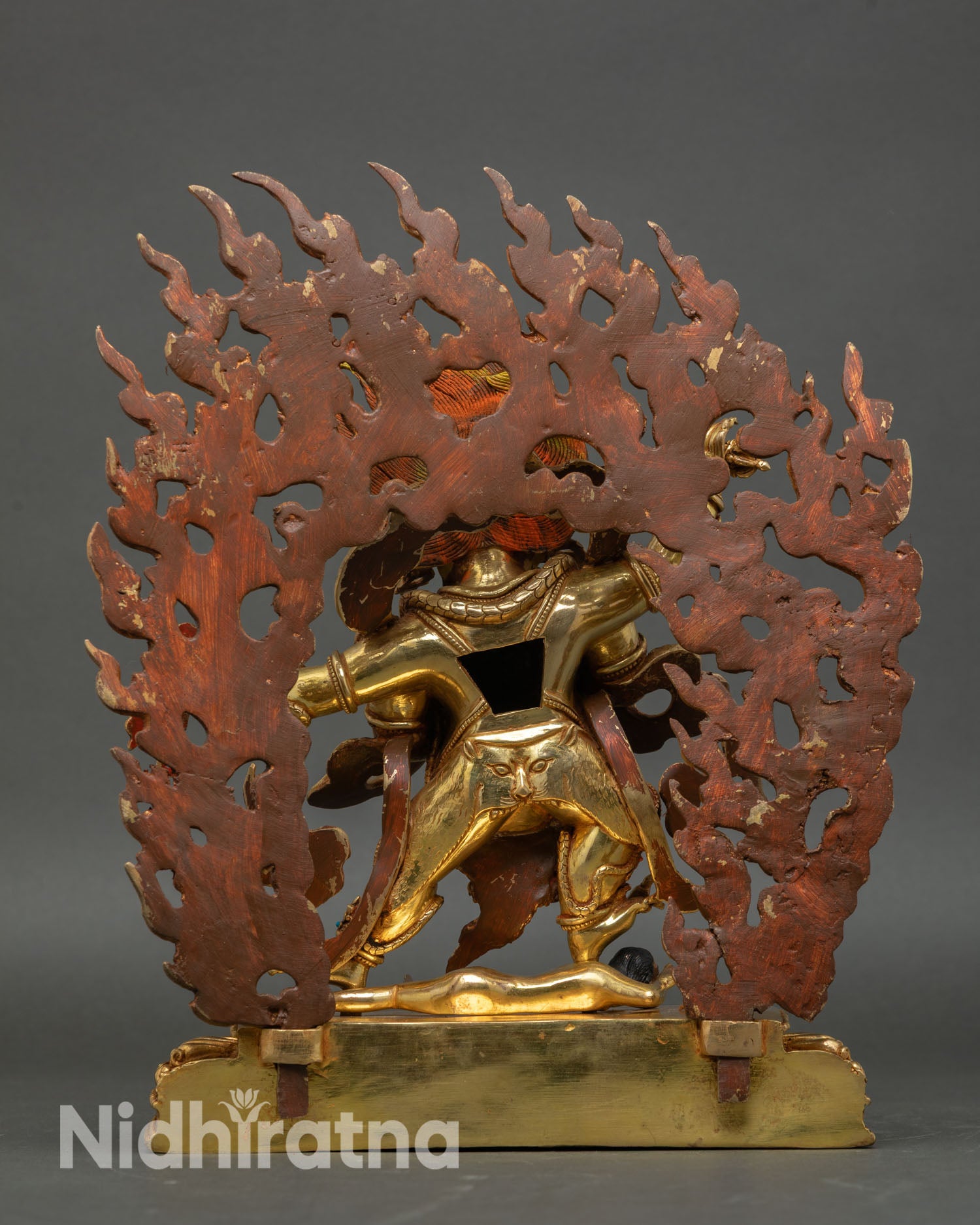 Back view of Four-Armed Vajrapani statue with flaming halo handcrafted Nepal copper 24K gold gilded spiritual protector