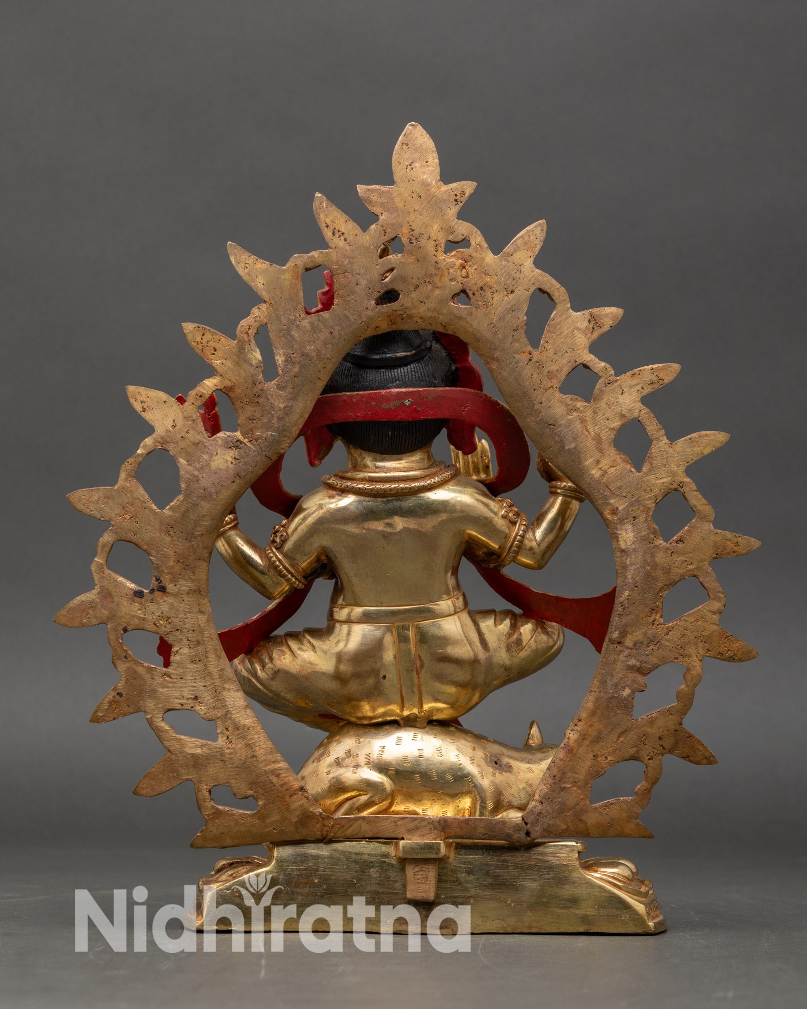 Back view Ganesh sculpture Hindu deity gold gilded copper sacred protective art