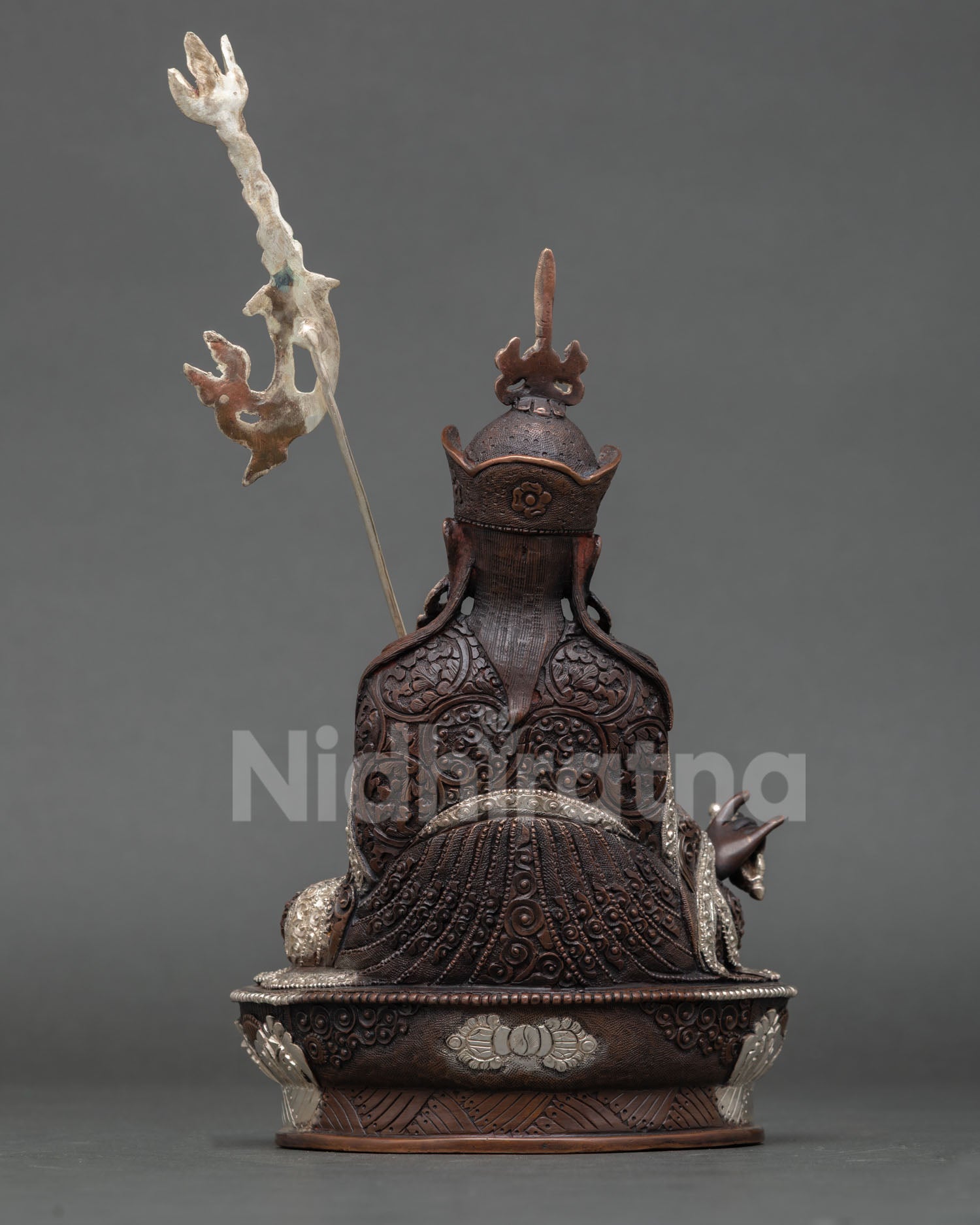 Back view of Guru Rinpoche statue, lotus throne base detailed craftsmanship, handmade sacred Buddhist sculpture, meditation shrine home altar decor
