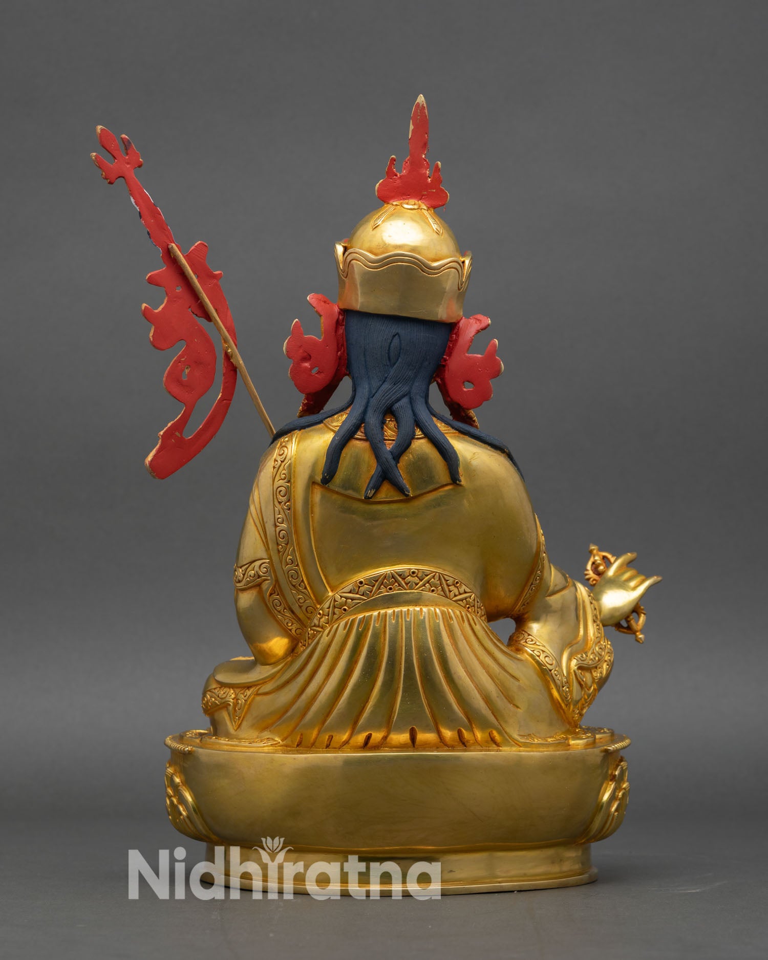 Back view of Guru Rinpoche Statue showing lotus throne and ritual symbolic details