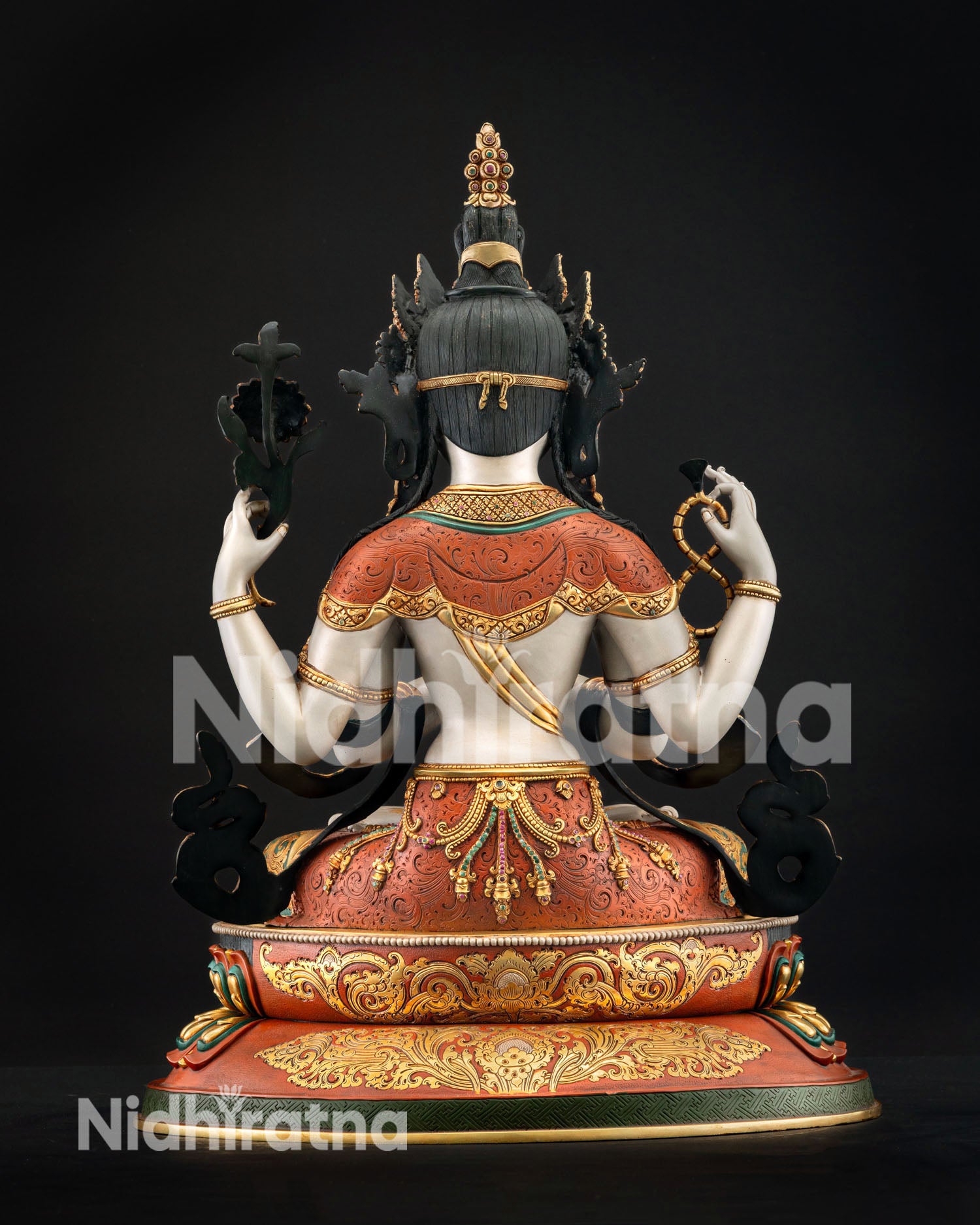 Back view handcrafted Chenrezig statue displaying detailed metalwork white body finish and traditional Himalayan artistry